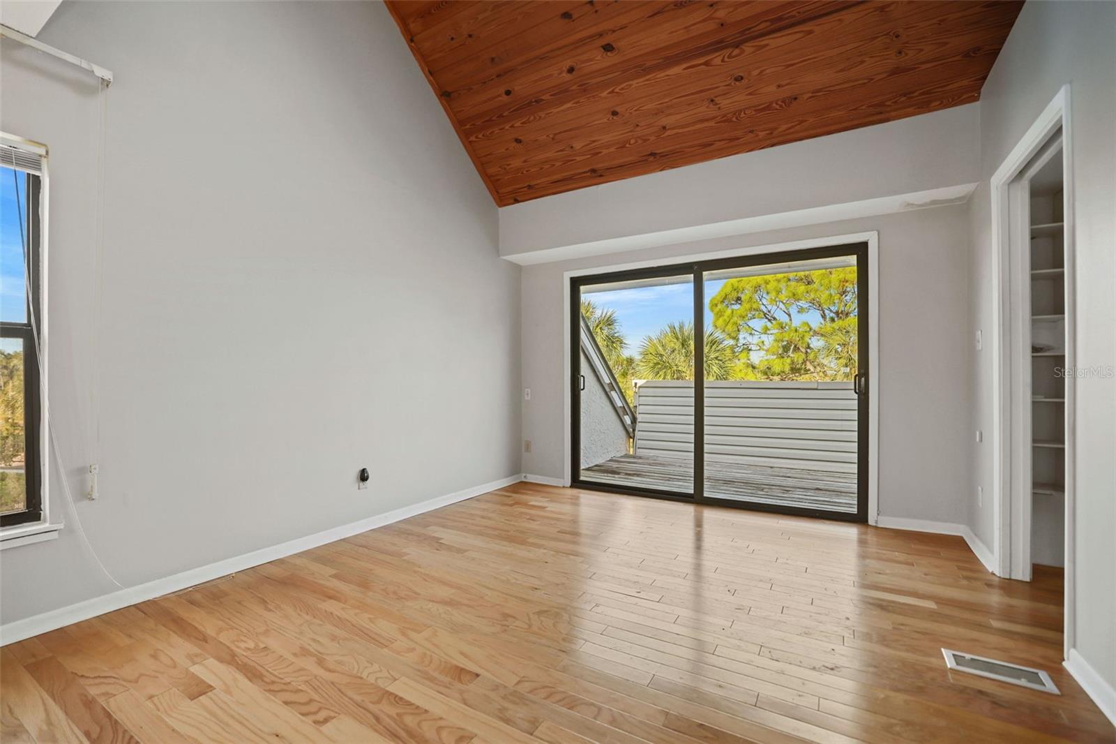 Master Bedroom.  Vaulted Ceiling and Sliders to Balcony