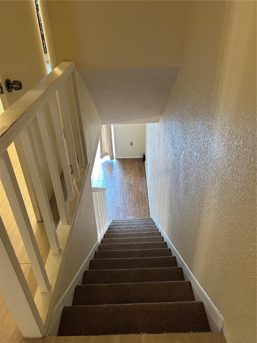 Staircase from 2nd floor down to 1st floor.