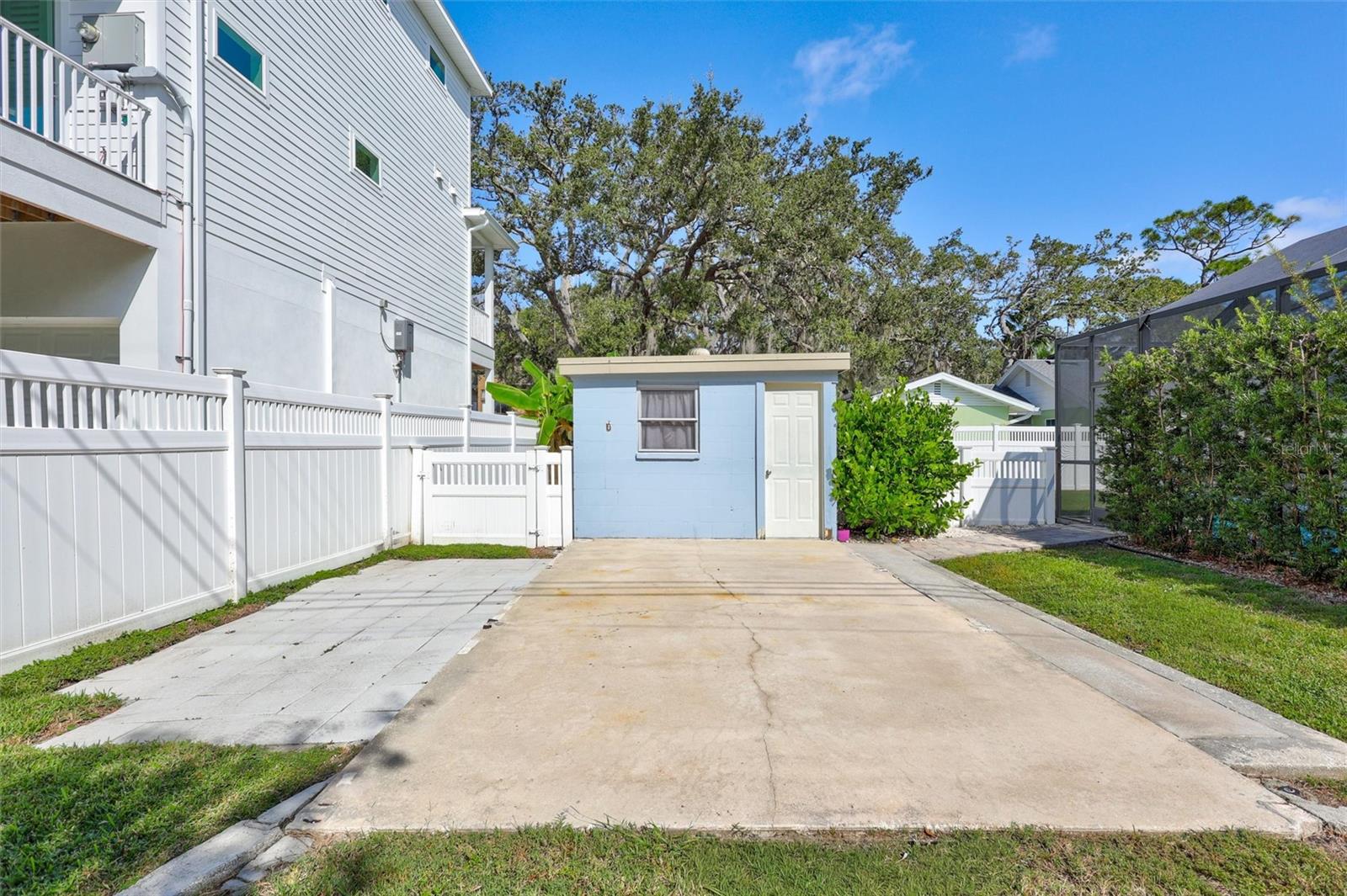 Additional gated parking pad with Block shed/workshop