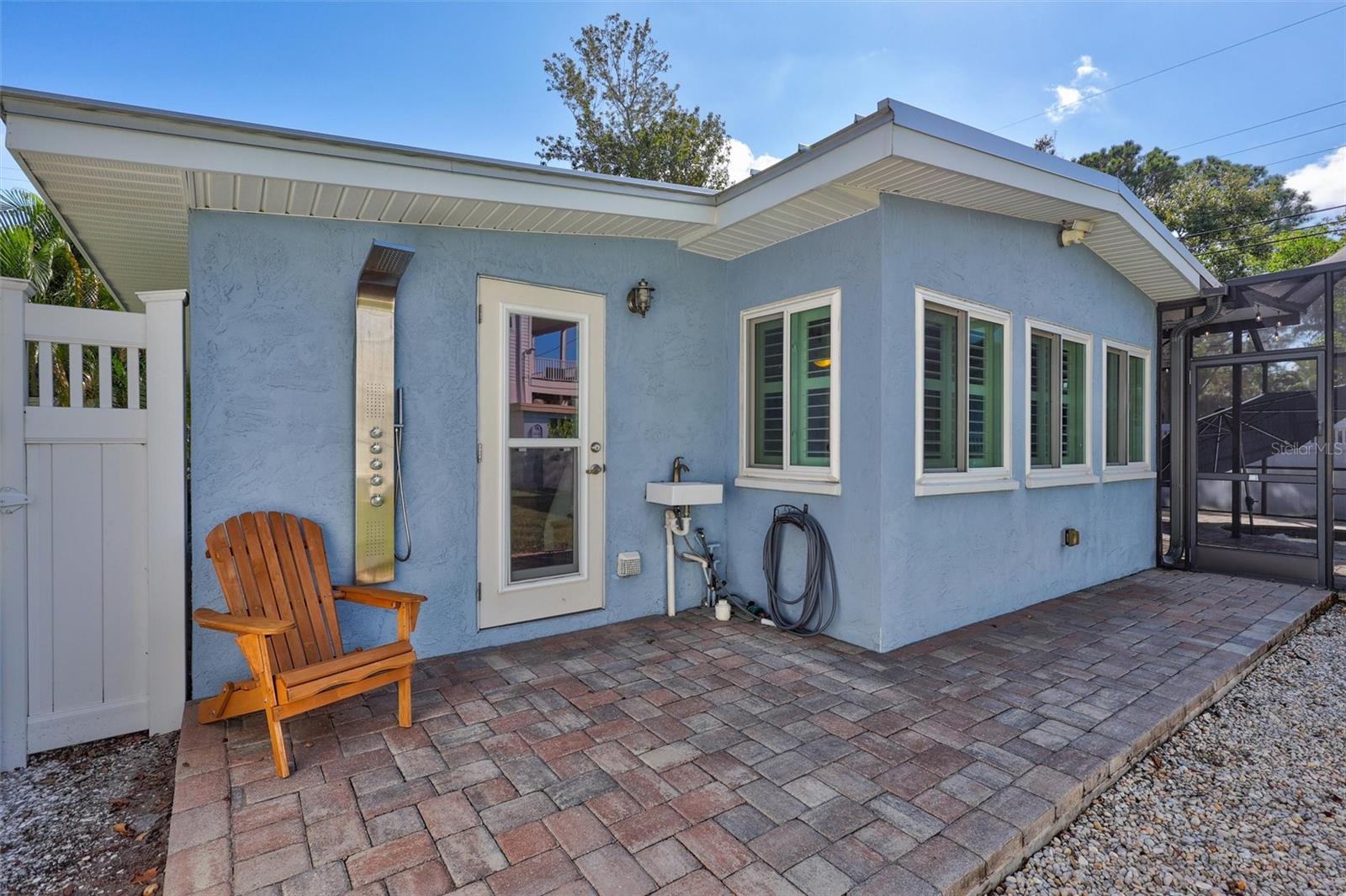 Outdoor shower. Door leads into the indoor laundry room