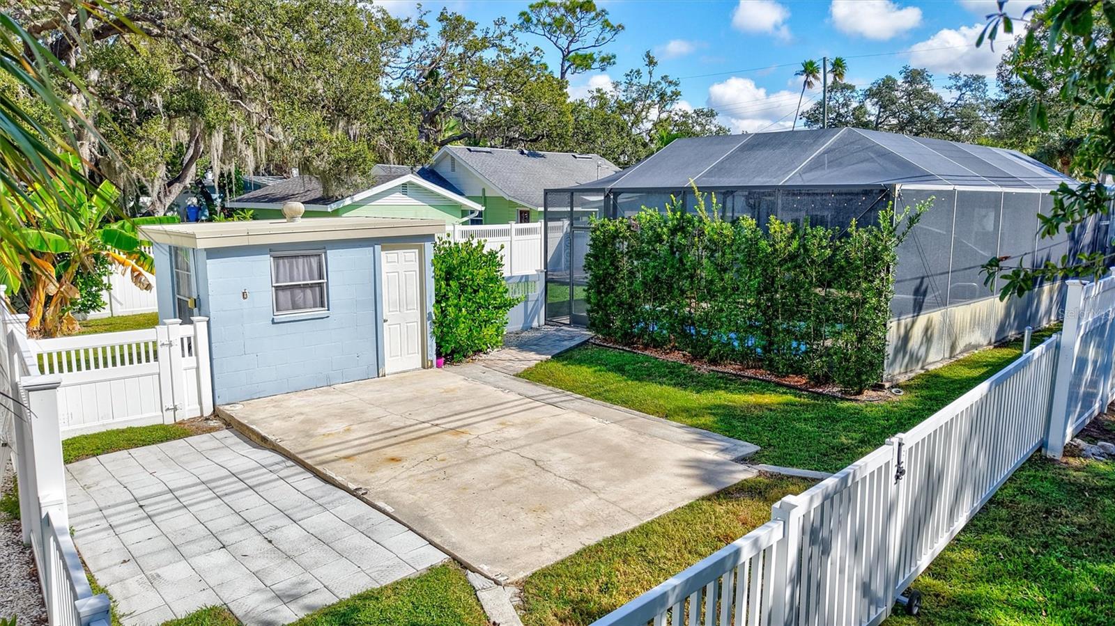 Gated parking pad in back of the home