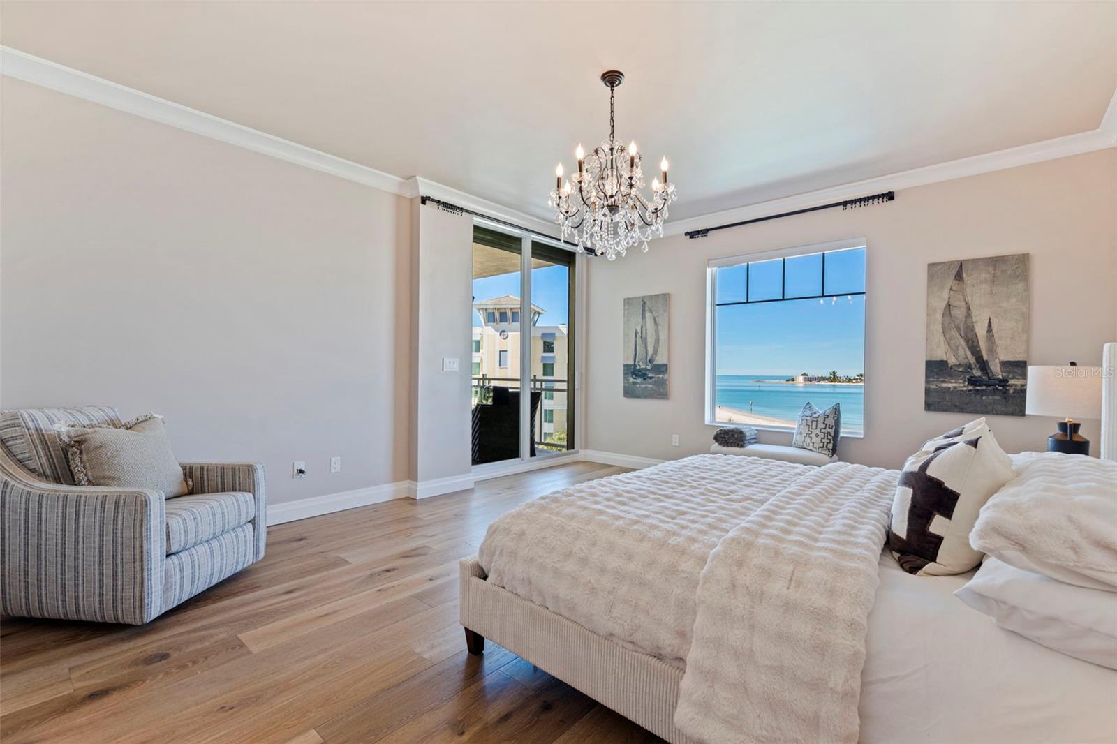 The primary suite offers captivating views of the Gulf and entrance to the patio.