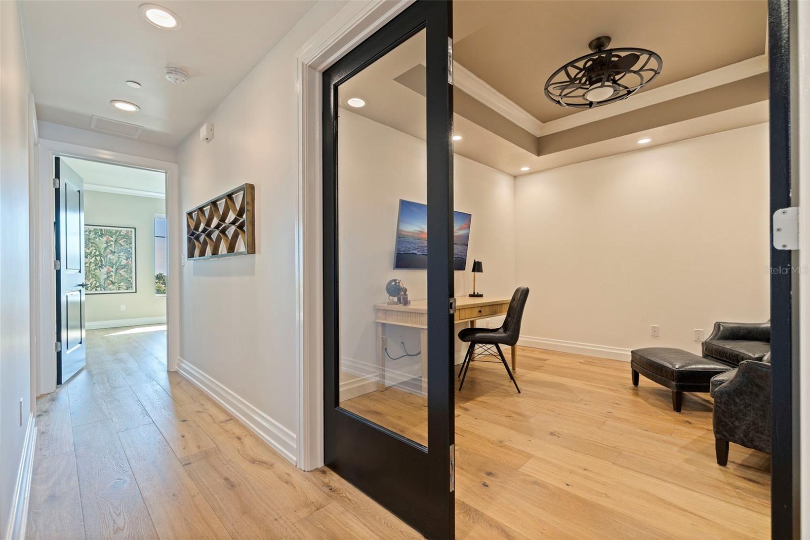 The office/ den offers double glass doors for privacy.