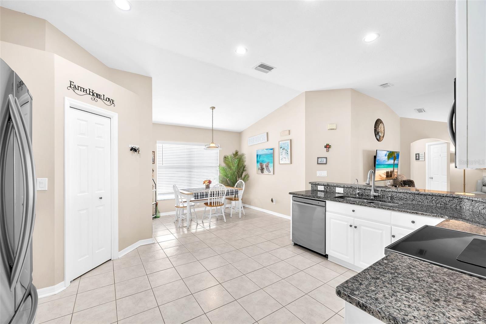 Large storage pantry for gadgets, cookware, and pantry staples.