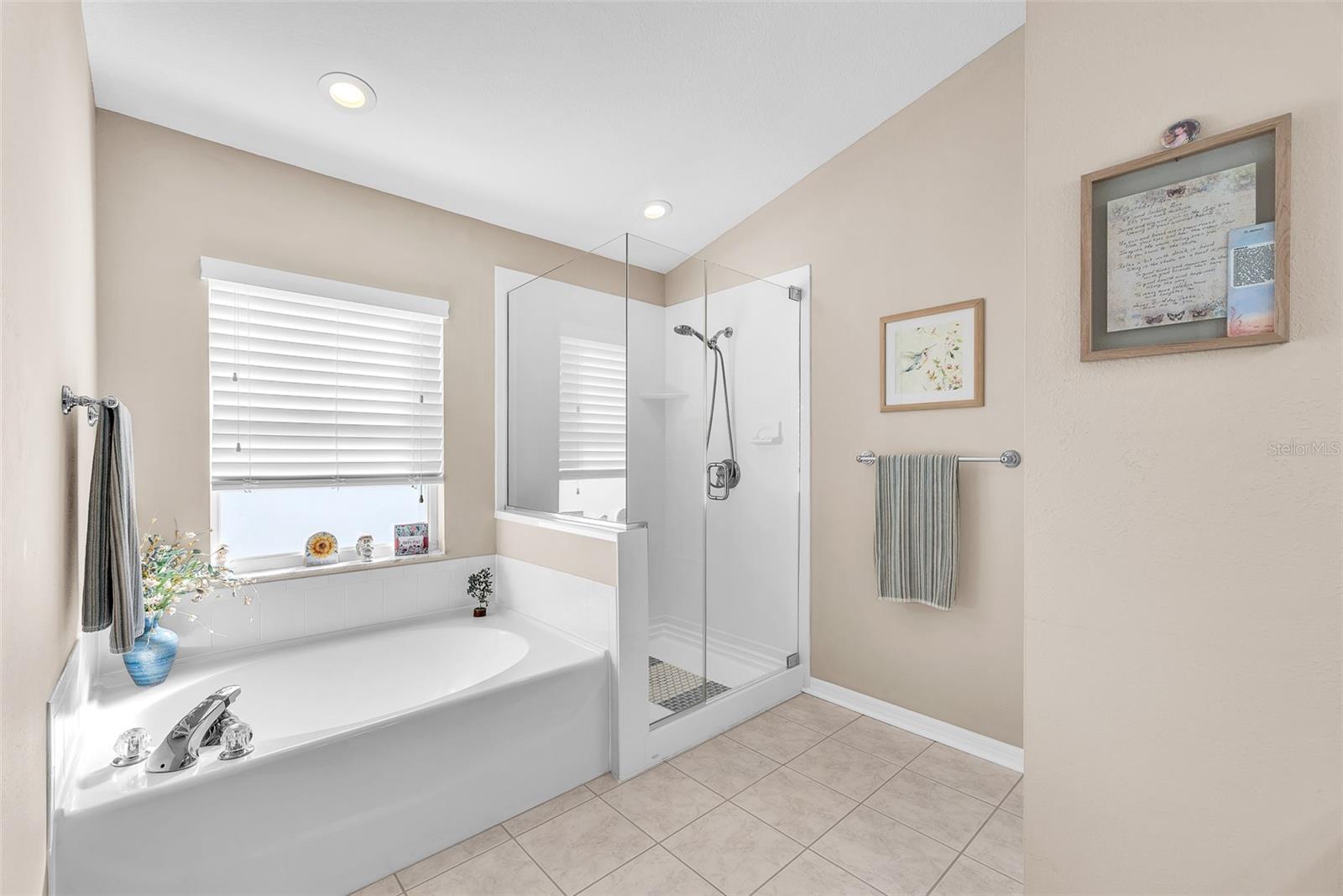 The primary bath has a garden tub and separate shower.