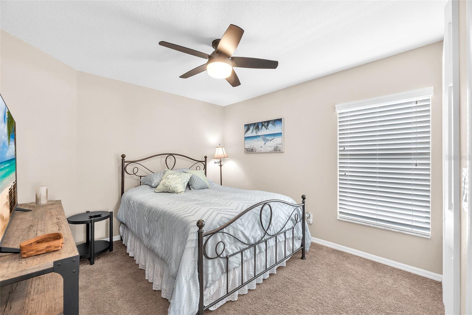 The secondary bedrooms are across the great room from the primary and share a bathroom.