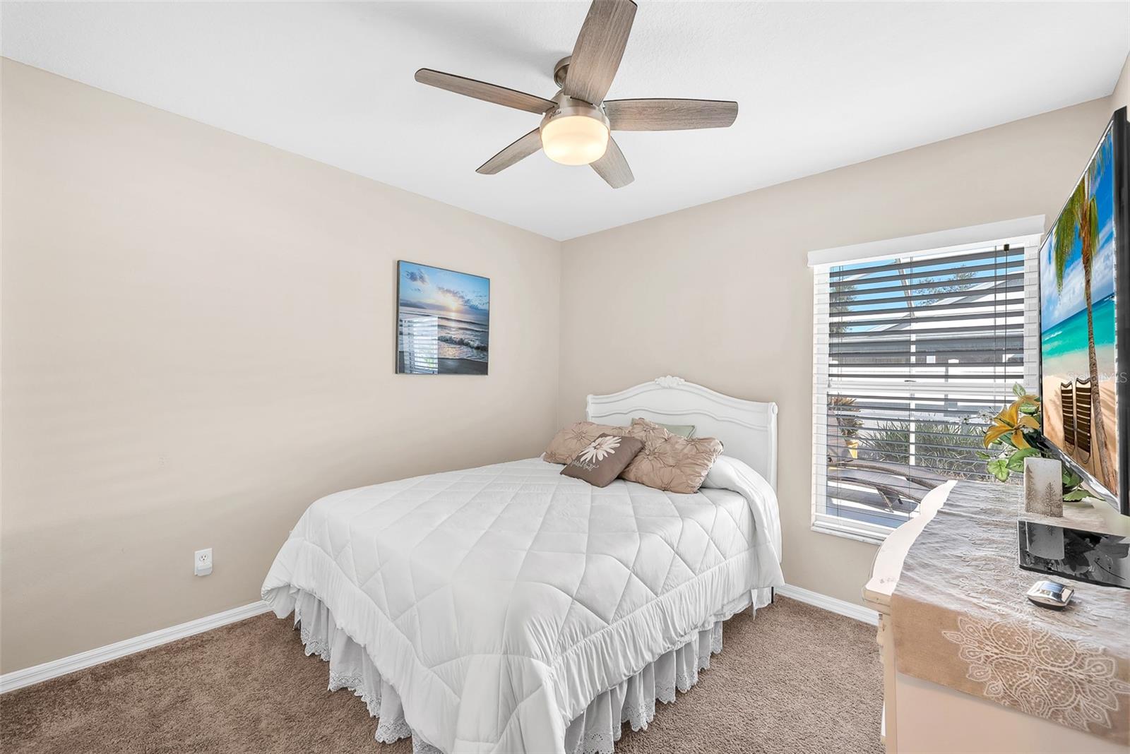 The secondary bedrooms are across the great room from the primary and share a bathroom.