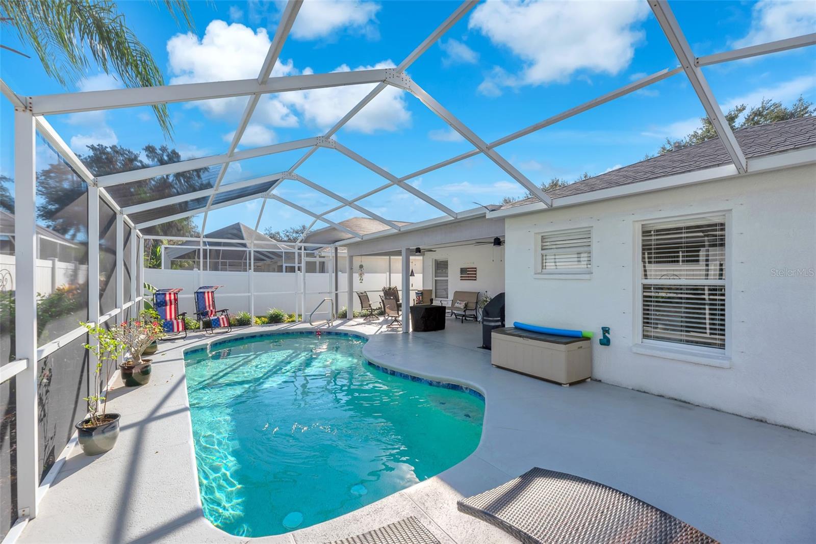 Screened lanai with a solar heated pool.  Perfect for relaxing or entertaining.