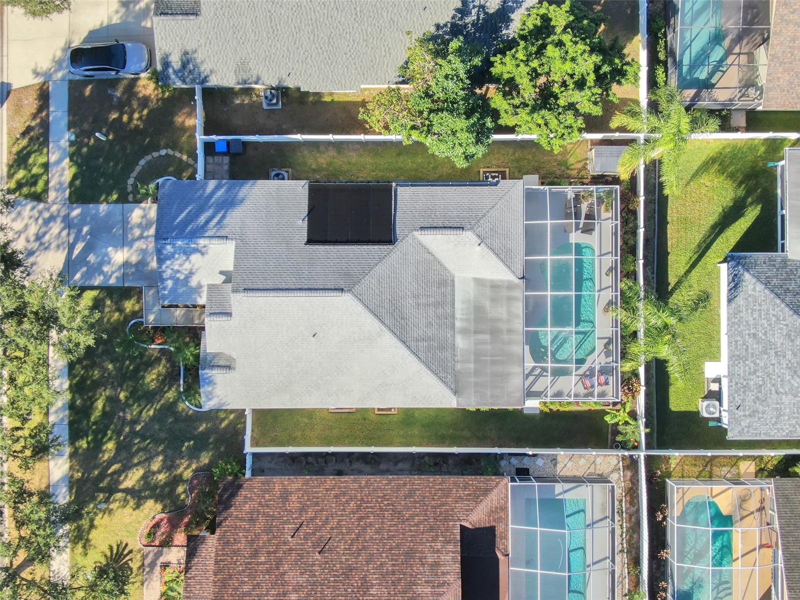 See the property lines and nearby community from above.