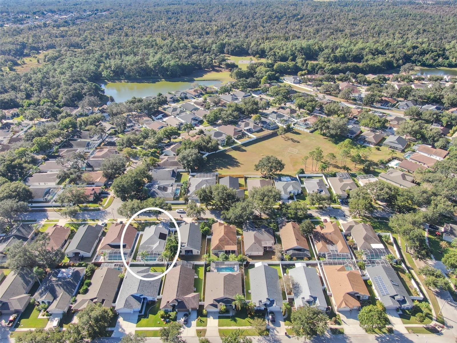 Aerial perspective highlighting the property and its surroundings.