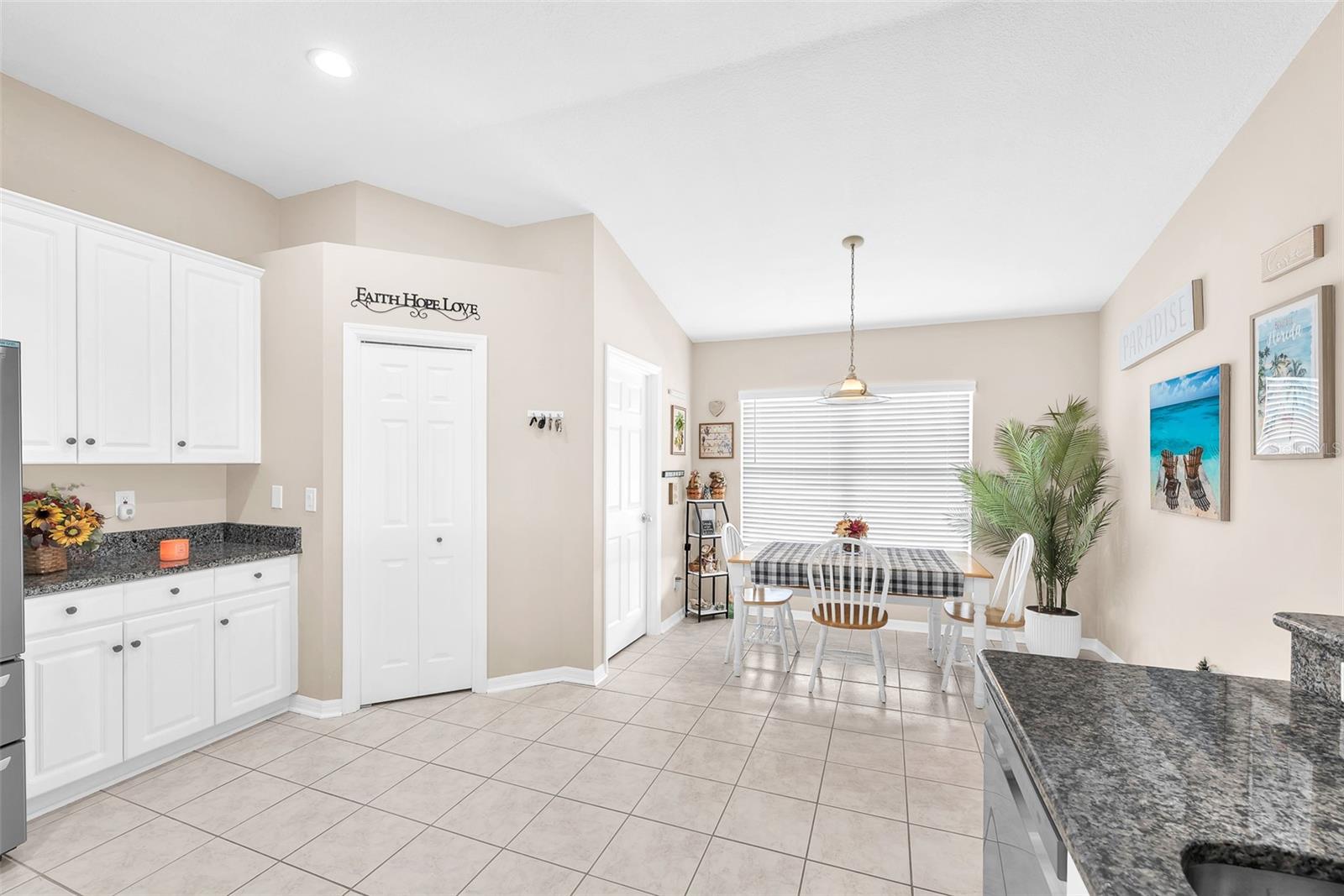 Enjoy morning coffee in this bright, window-lined breakfast nook.