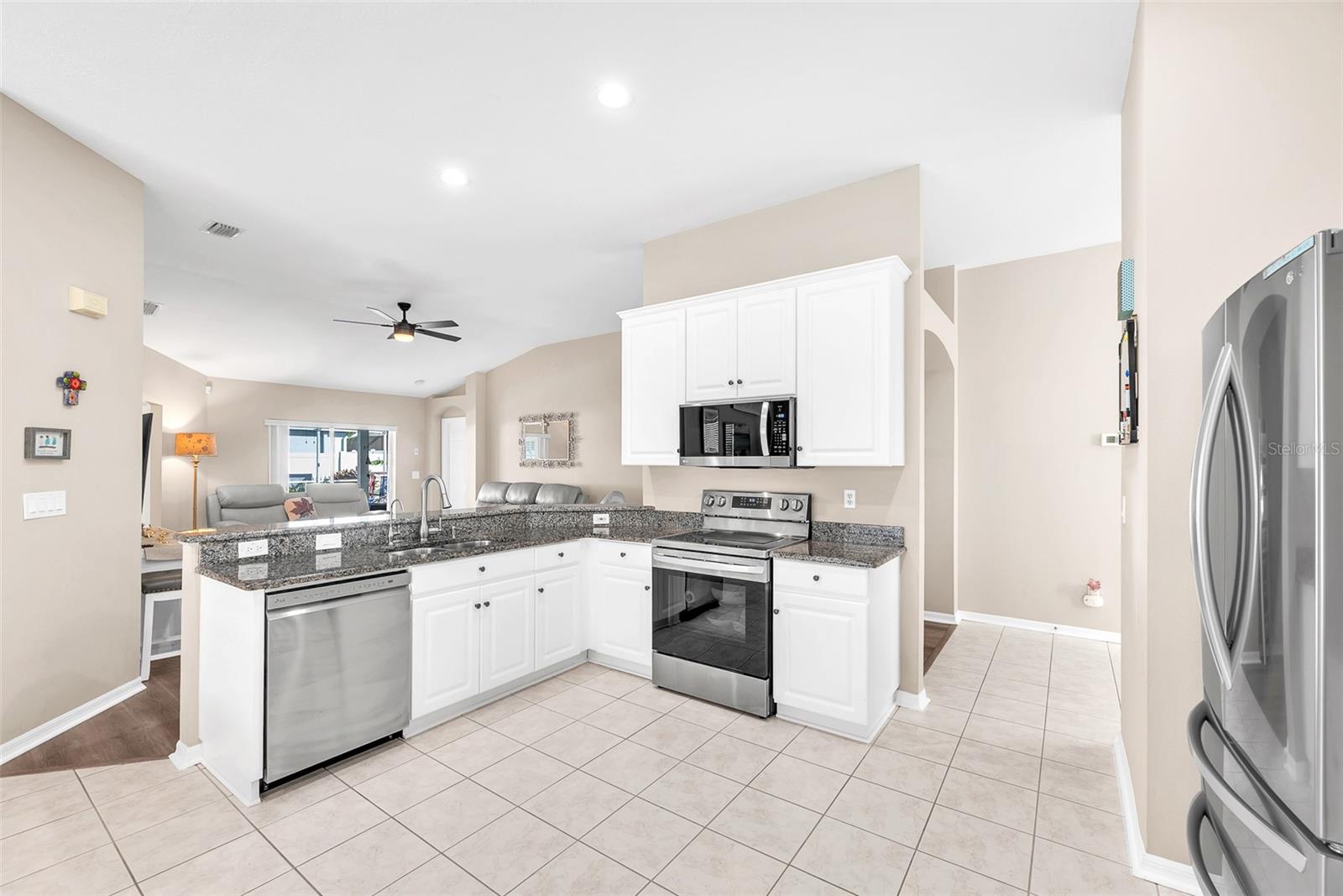 Open-concept kitchen with generous breakfast bar and great workspace design.