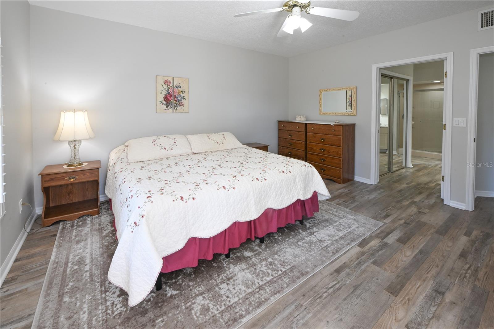 Master Bedroom , with vinyl flooring & leading to ensuite bath