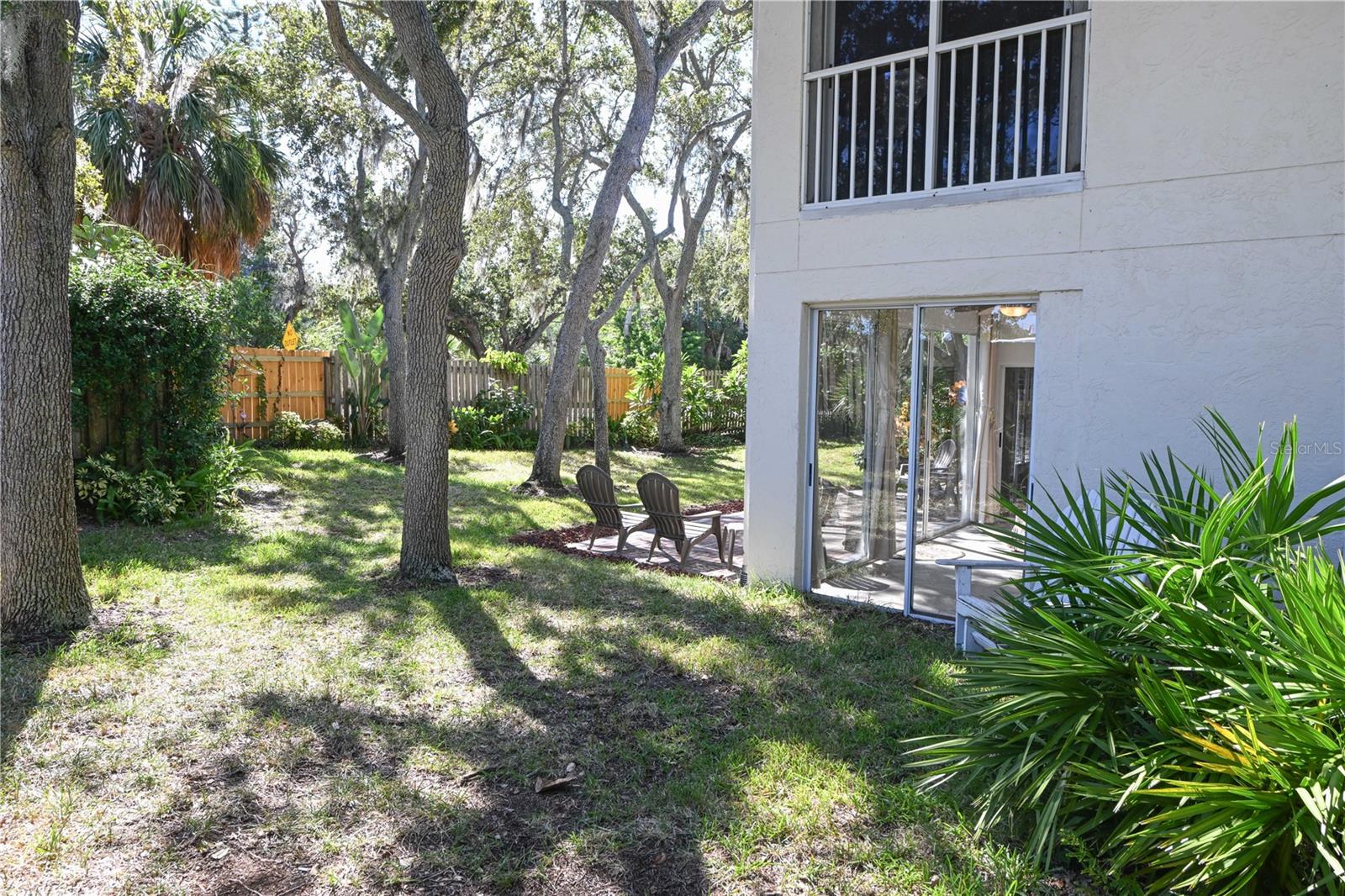 Side yard with beautiful trees