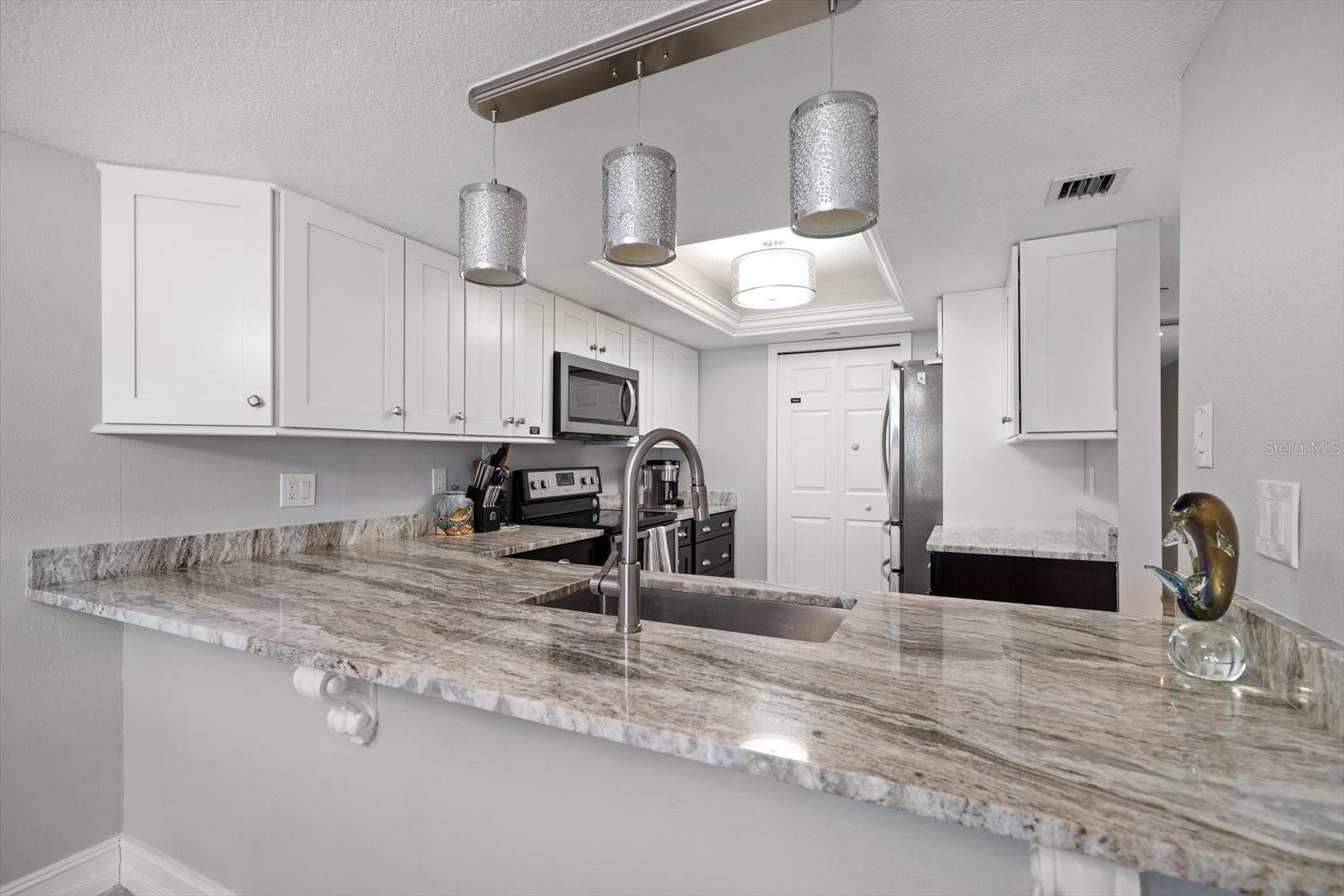 Breakfast bar is perfect for entertaining or providing that extra area always appreciated when friends or family stop by!