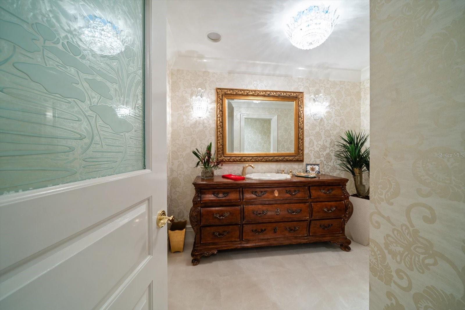 Guest bath area is located by grand foyer-attractive finishes thoughtfully detail every aspect of this property.