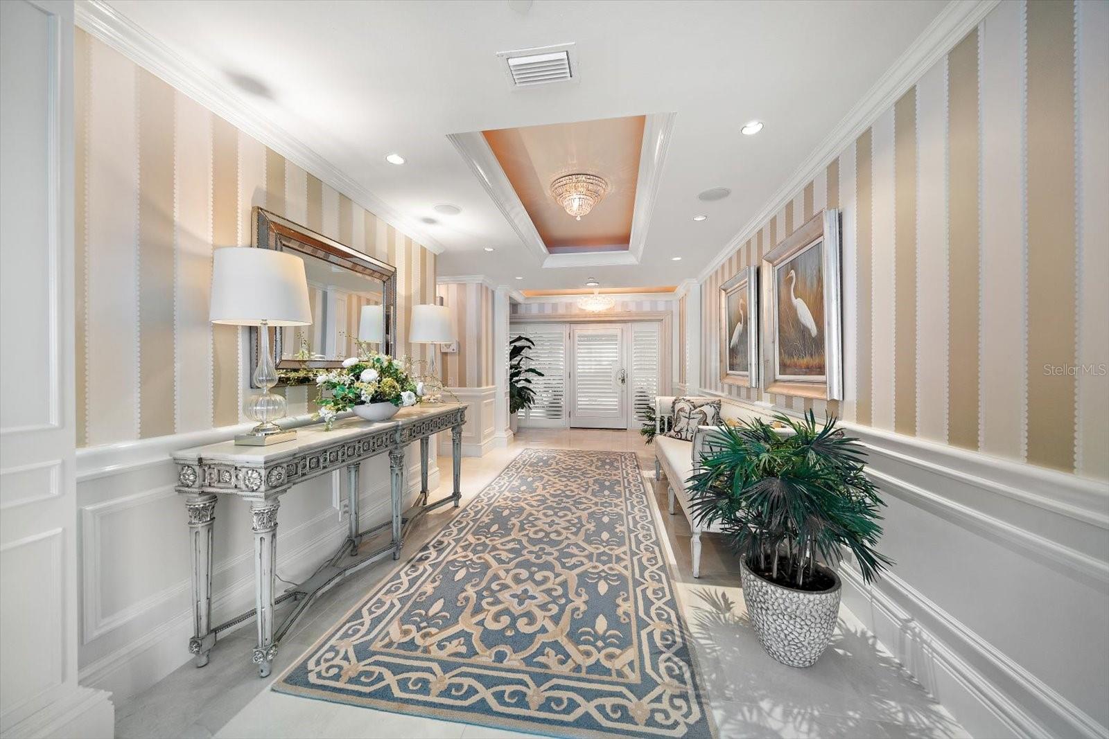 Elegant yet understated foyer provides a comforting, welcoming.