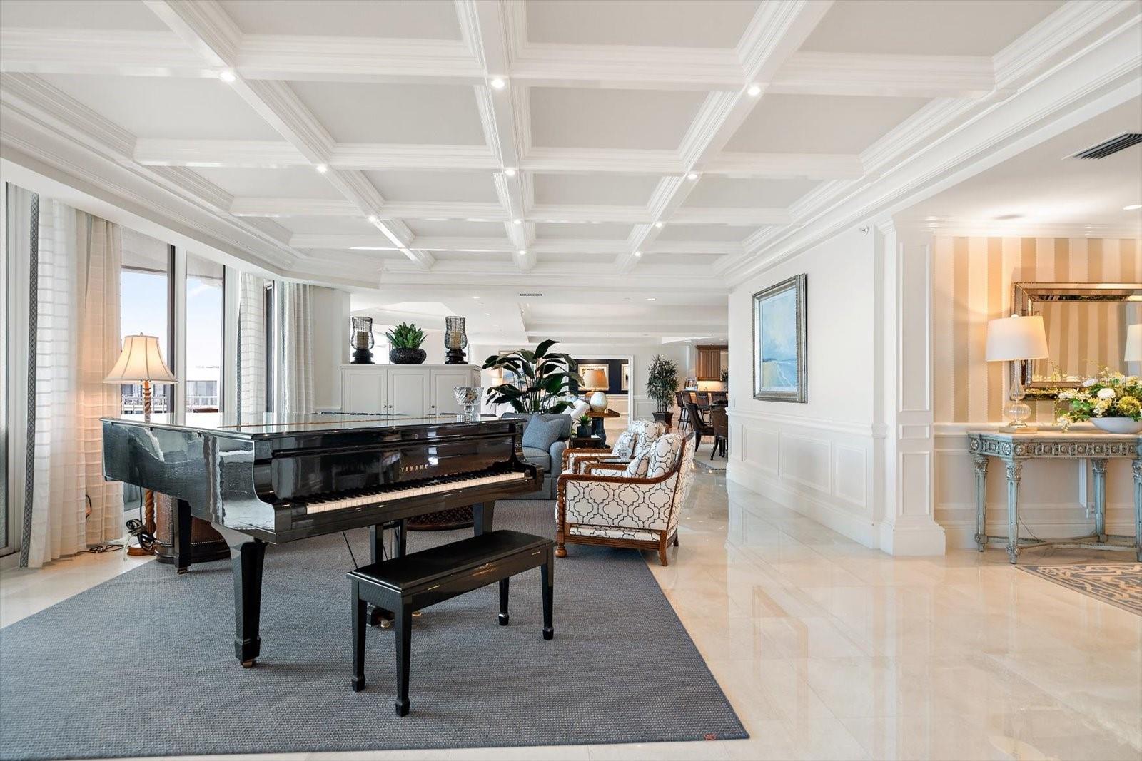 The multiple living spaces create an ambiance of understated luxury and serene refinement, perfectly framing the open water vistas beyond.