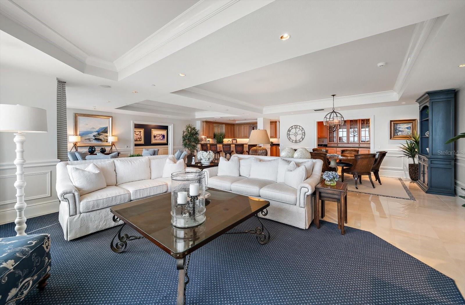 Perfect for casual gatherings or quiet evenings by the water, this room blends classic coastal style with timeless luxury, creating a serene retreat within the residence.