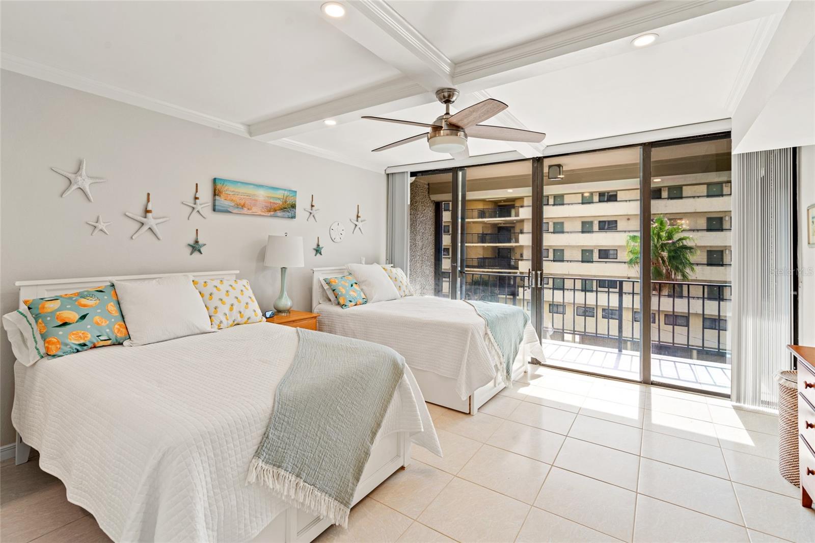 Bedroom with 2 beds and balcony. Furniture is included