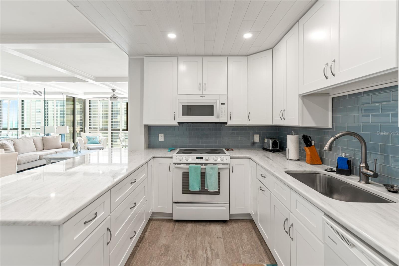 Modern kitchen with blue glass tiles