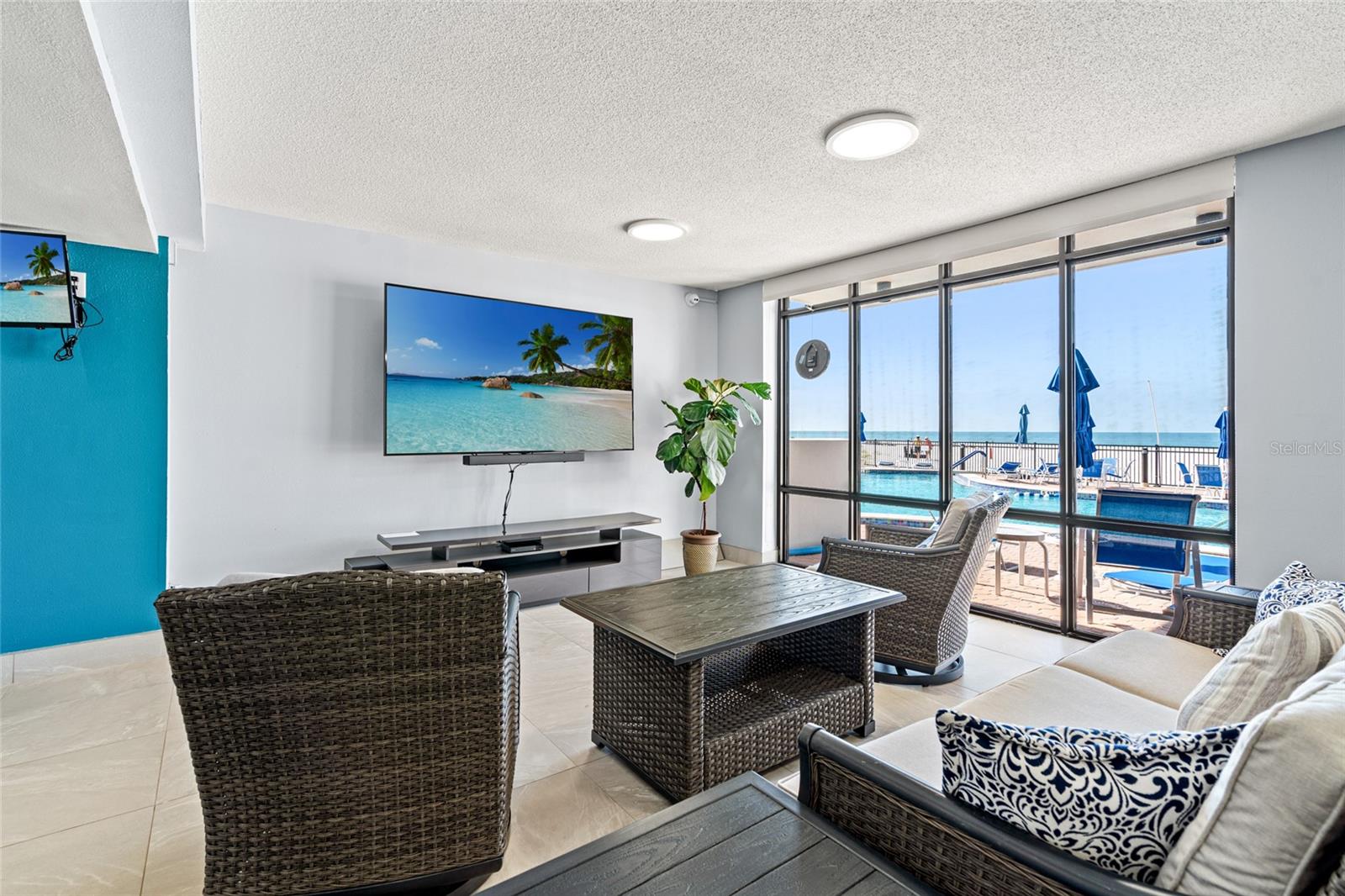 Rec room sitting area and watching sports off the pool deck