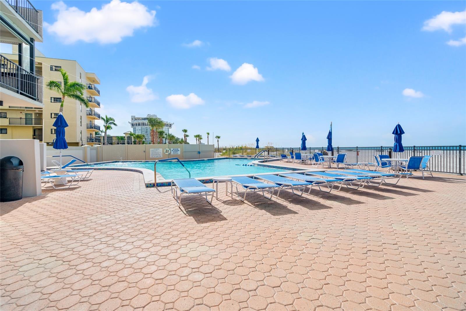 Pool deck with lots of lounge chairs