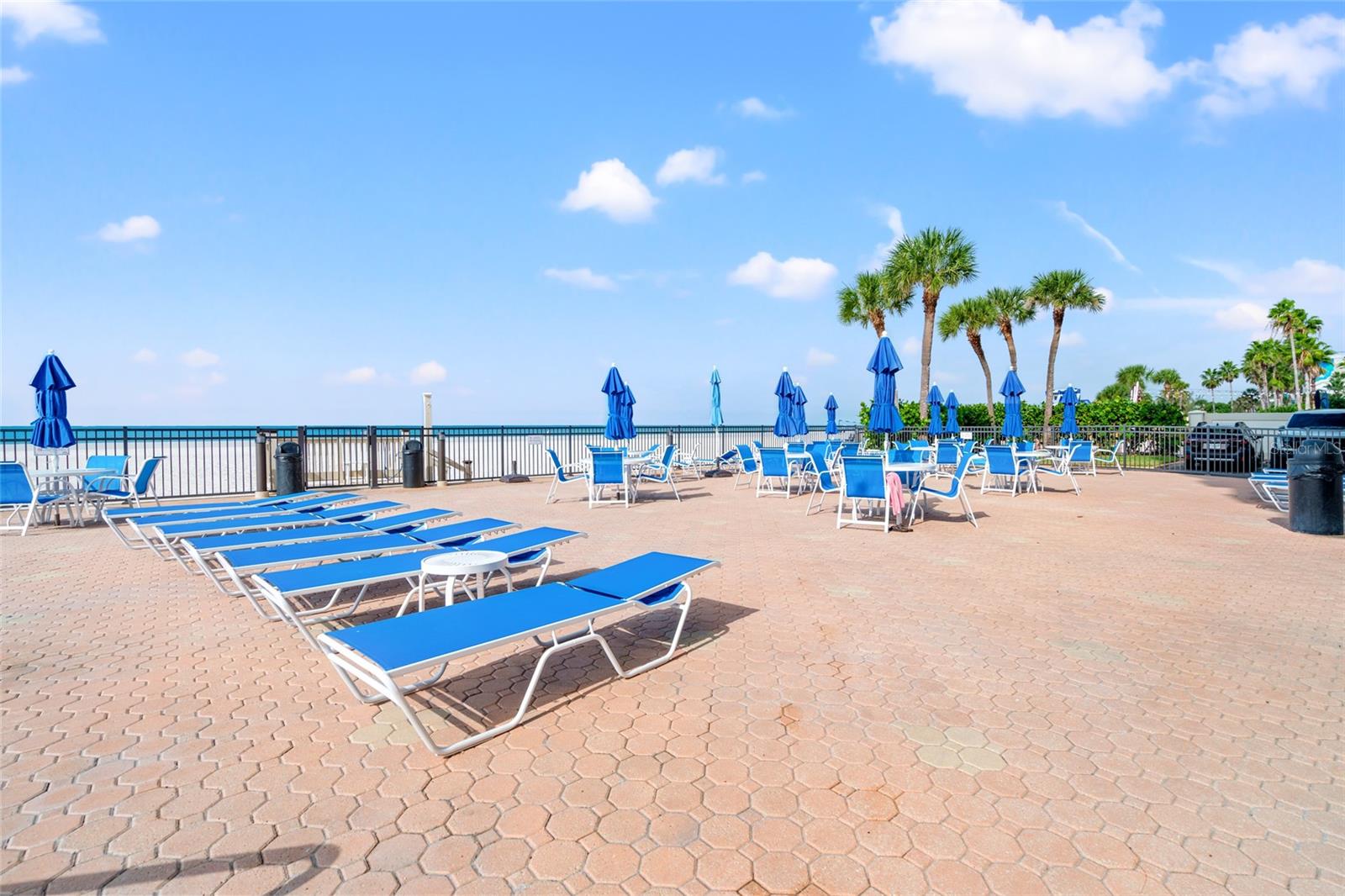 Lounge chairs or use a table and open the umbrellas for sun reprieve from the sun