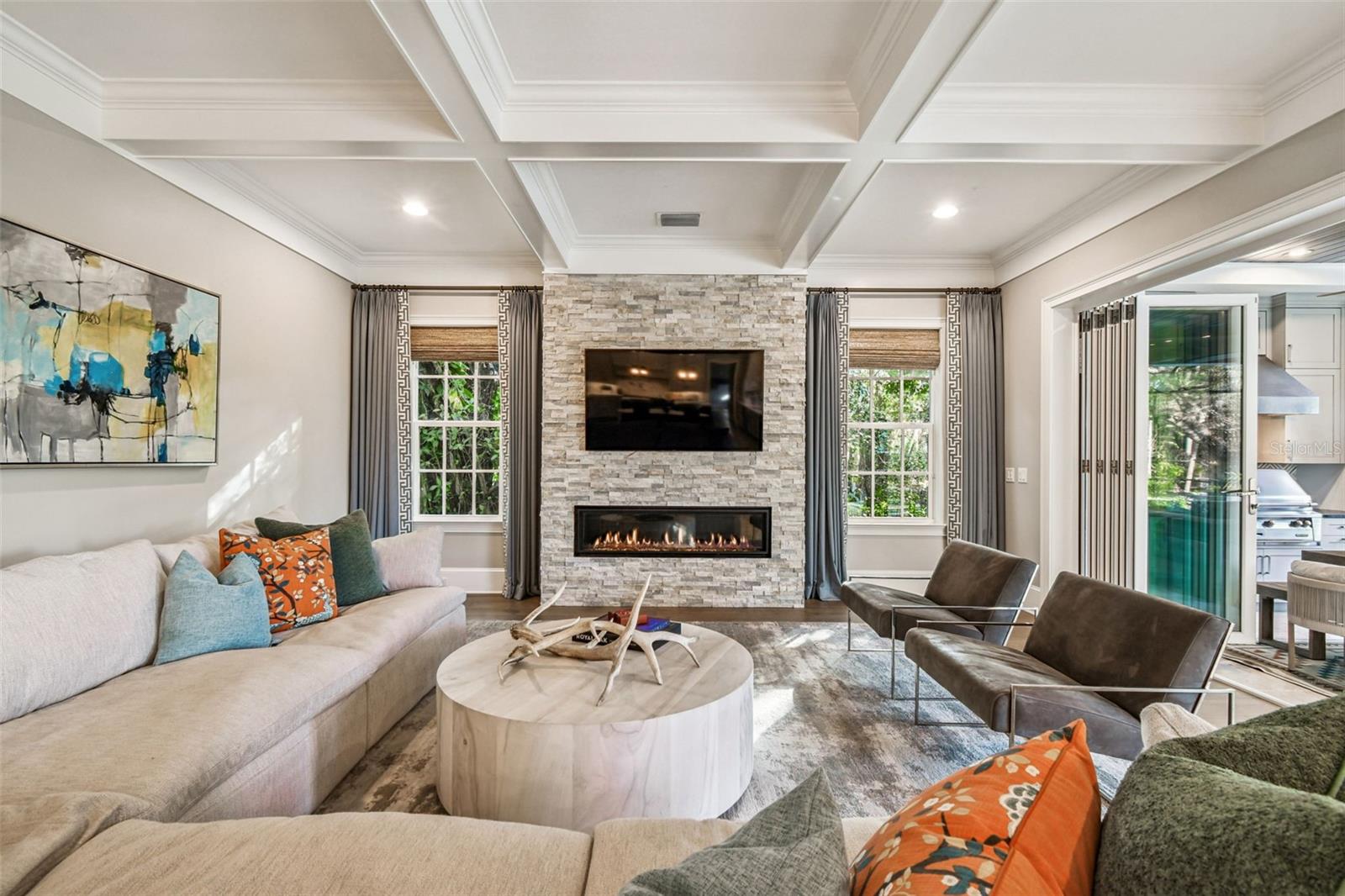 Family room w/ Fireplace that opens to Covered Porch