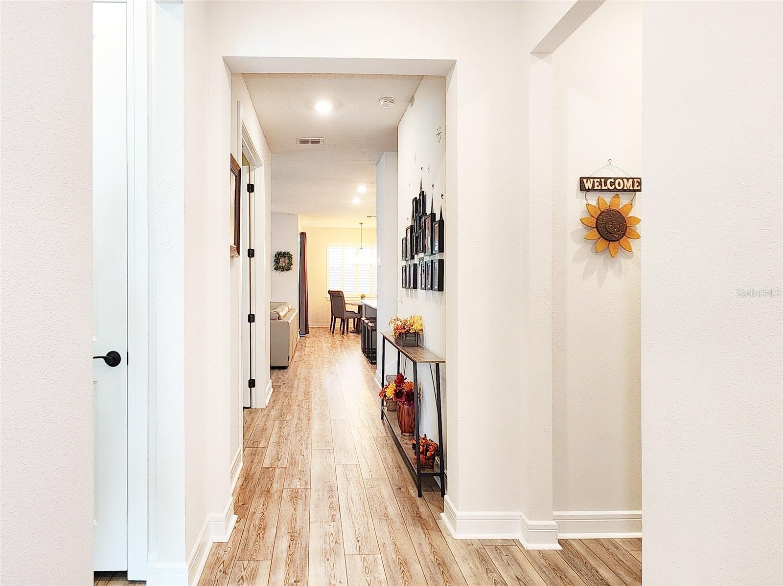 Laundry room to the right. First bedroom to the left