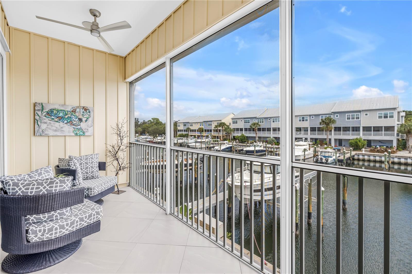 Screened in porch overlooking water
