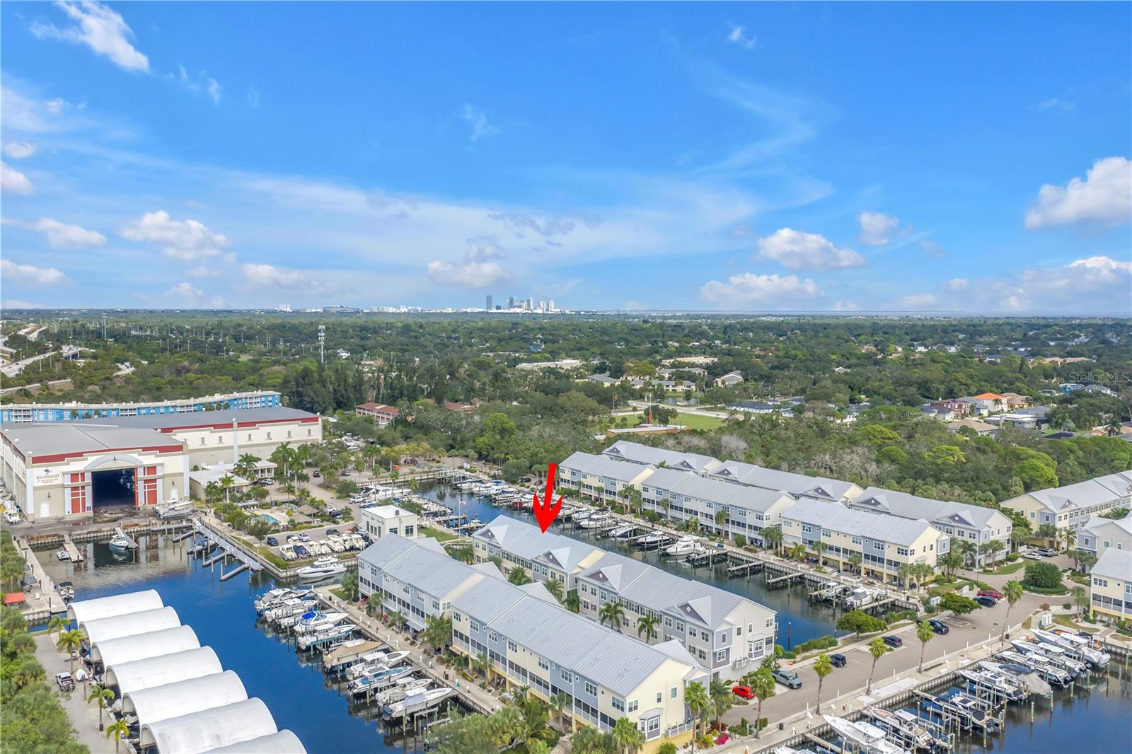 Aerial view of community and marina with downtown St Pete on the horizon