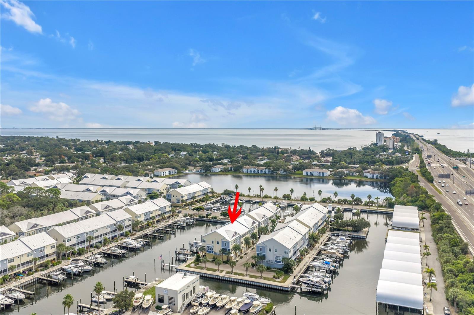 Aerial view looking south with the Skyway bridge on the horizon