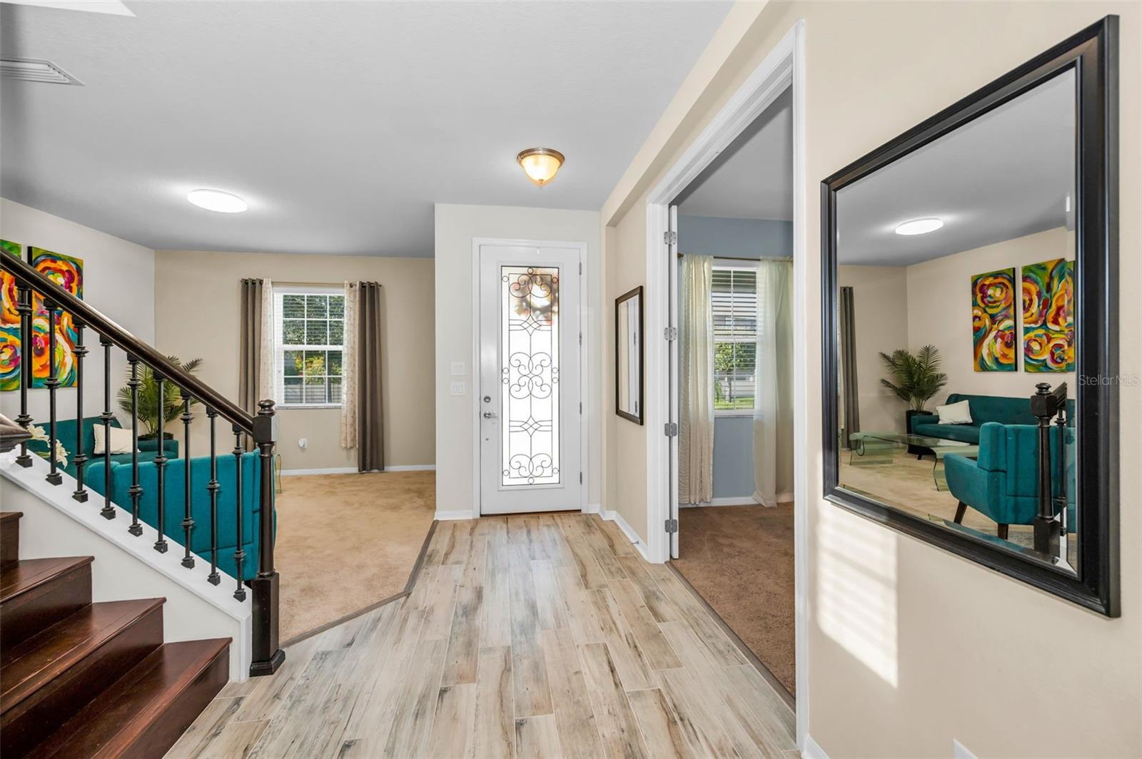 looking toward the entrance, living room is to the left and the den is to the right