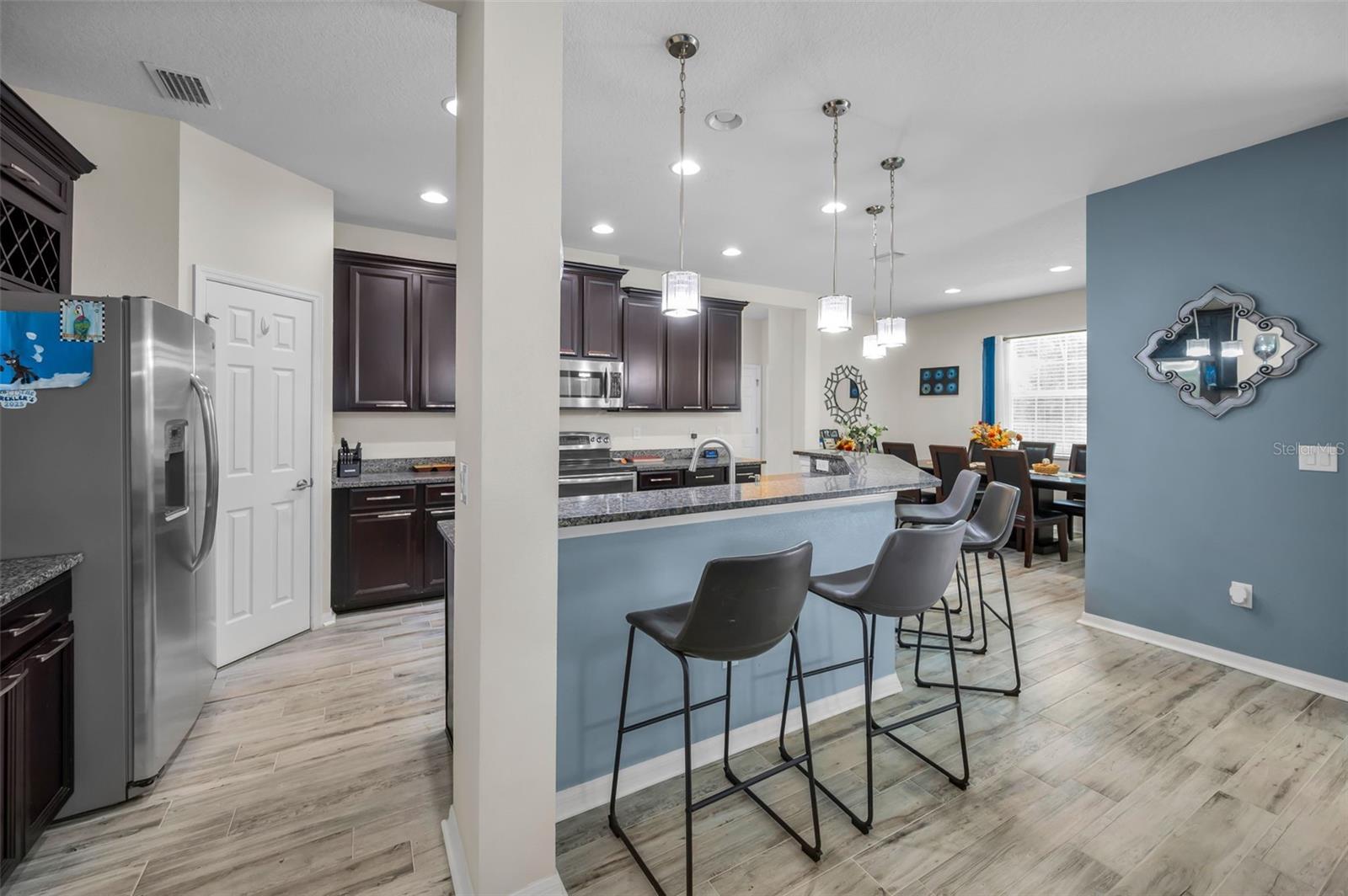 kitchen, breakfast bar, pantry, and dining room