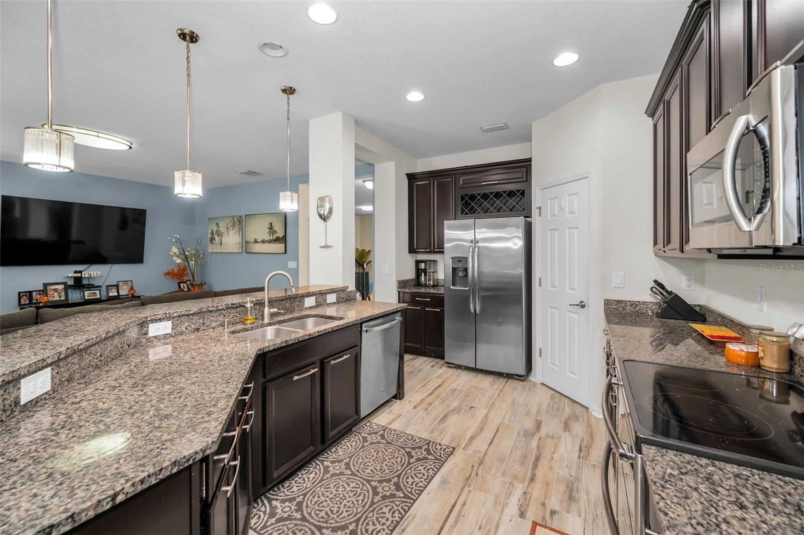 kitchen, breakfast bar, and family room