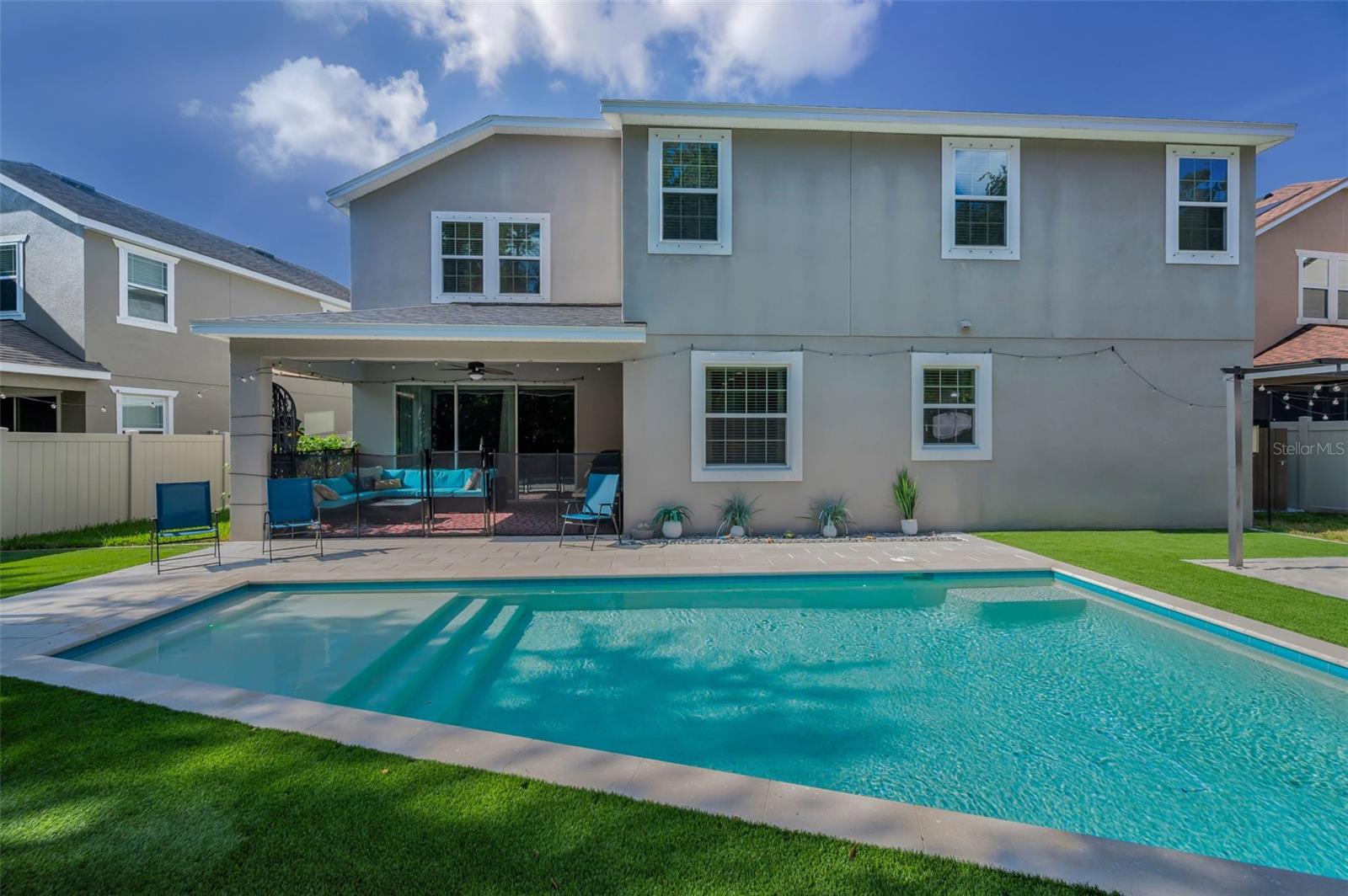rear of home, lanai, and pool
