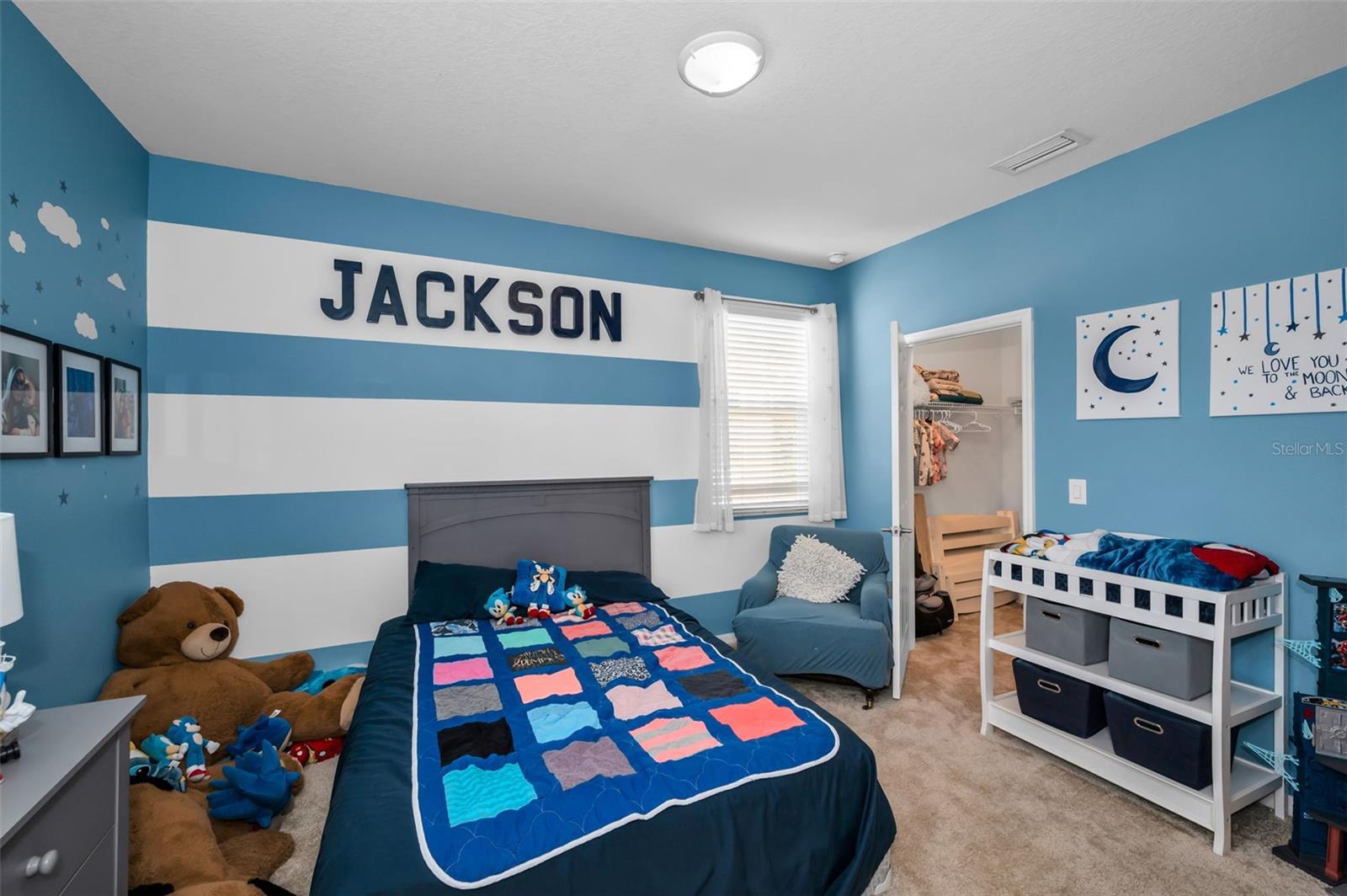 1 of 2 of the Jack/Jill bedrooms looking at its walk-in closet