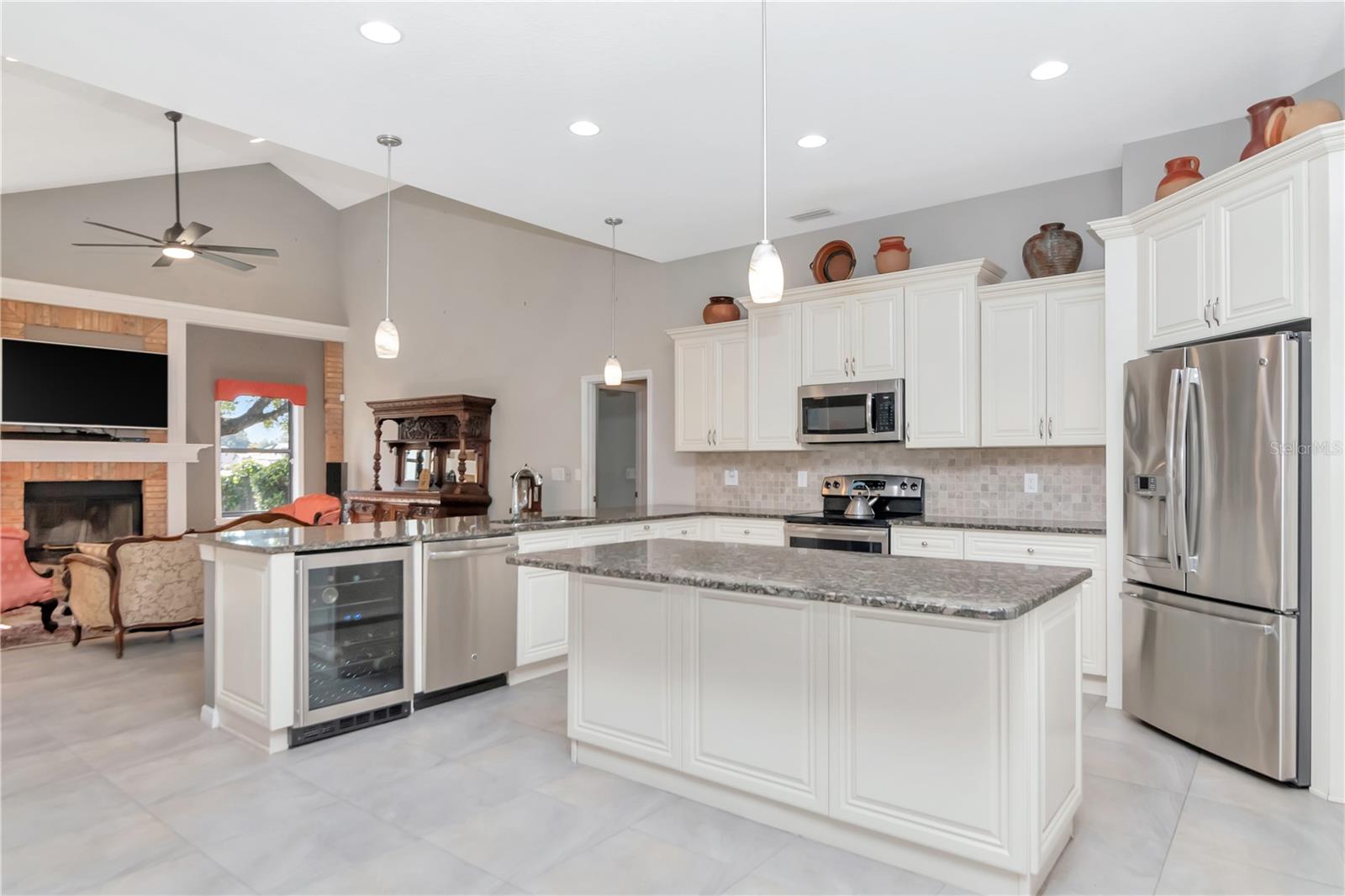 Fully updated kitchen with stainless steel appliances, wine cooler, large pantry, island AND breakfast bar