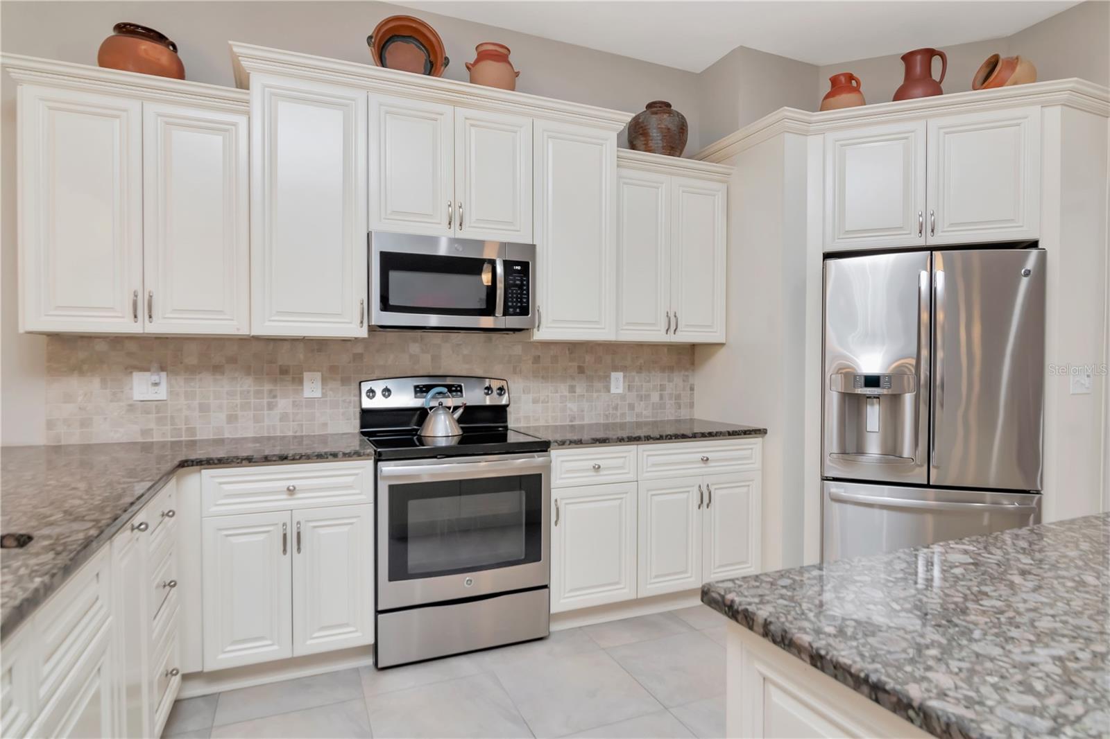 Fully updated kitchen with stainless steel appliances, large pantry, island AND breakfast bar