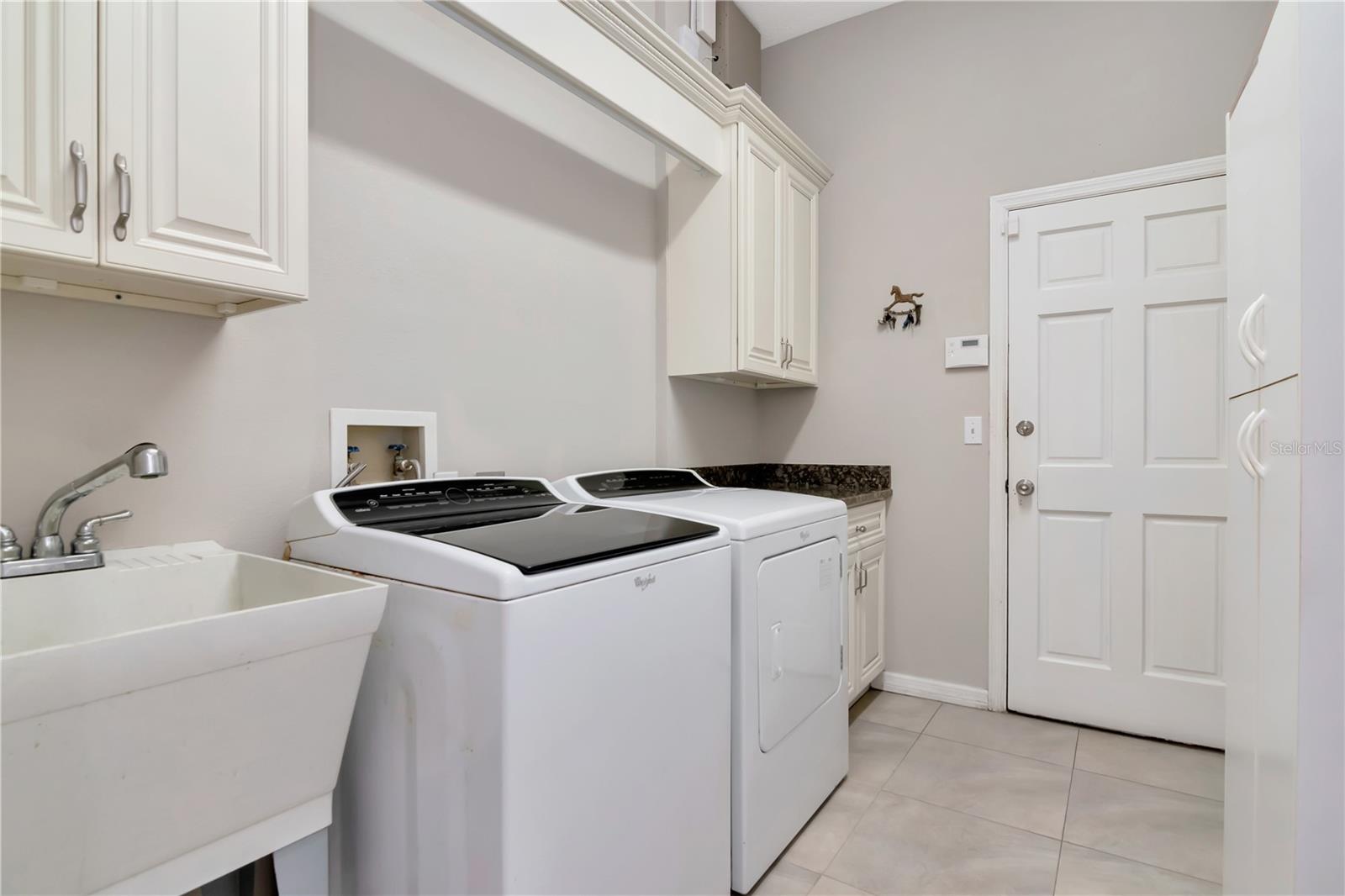 Laundry with storage and garage access