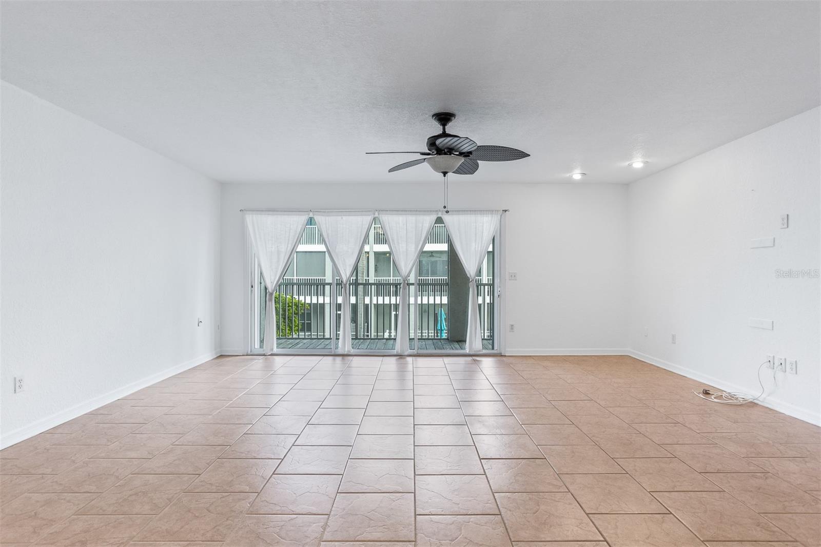 riple Sliding Glass doors with Storm Shutters to poolside Balcony