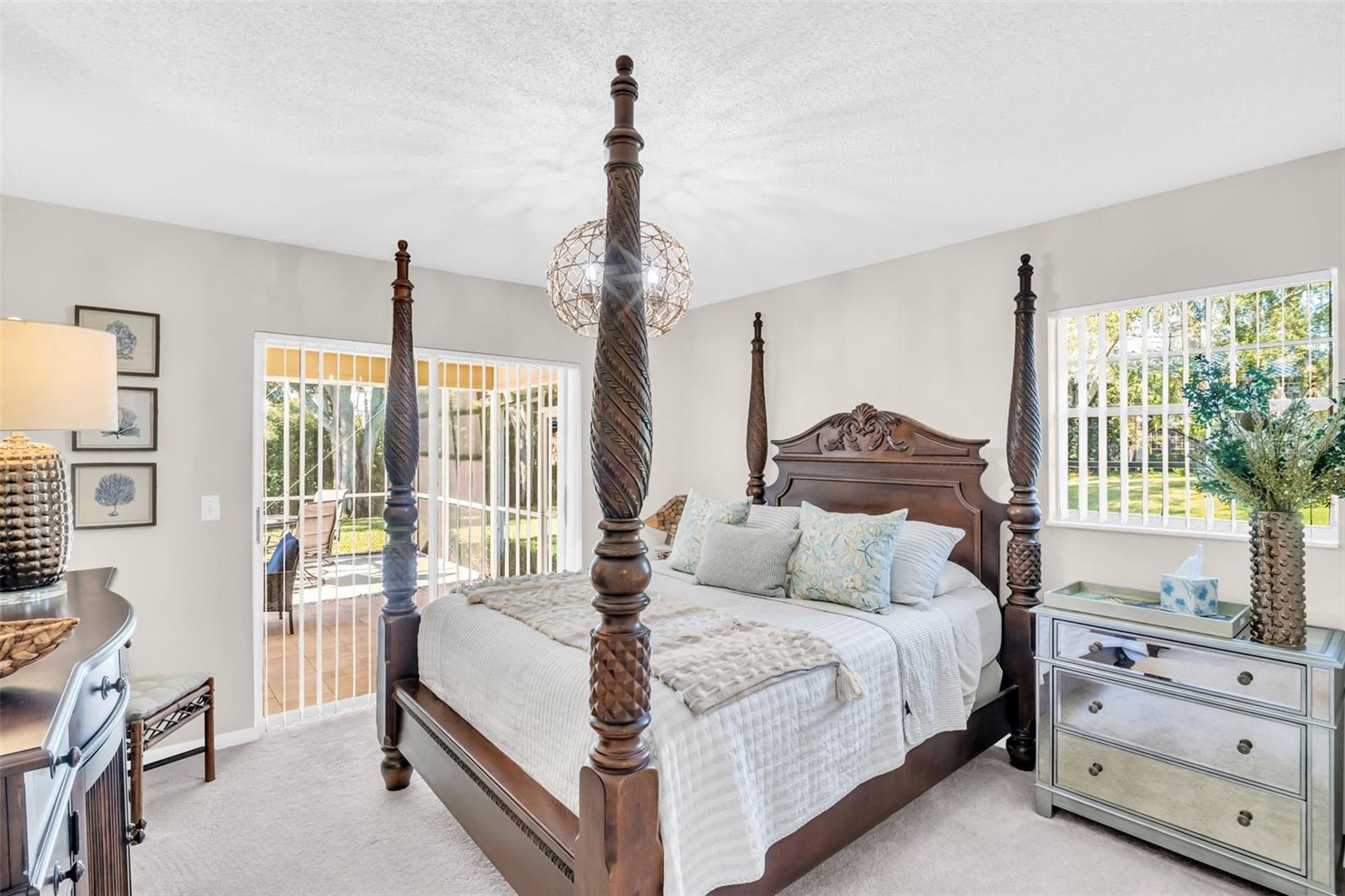 Bedroom 2 privately located at rear of home with slider access to pool~