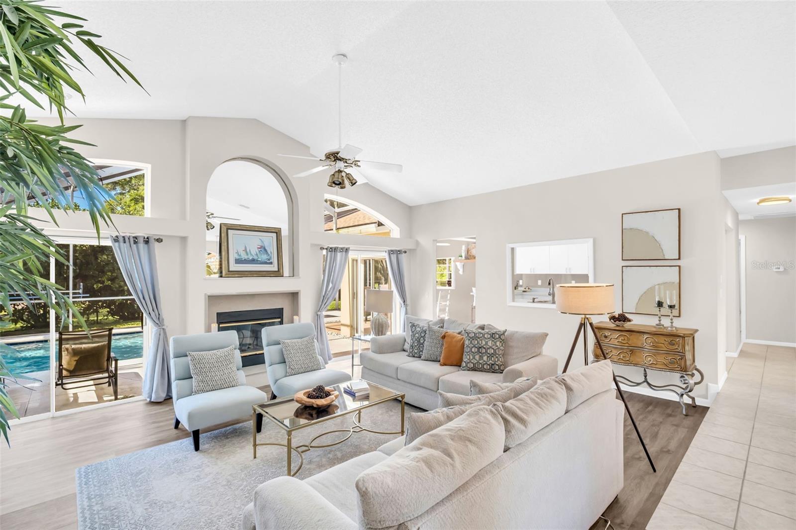 Soaring vaulted ceilings and beautiful pool view immediately upon entry~