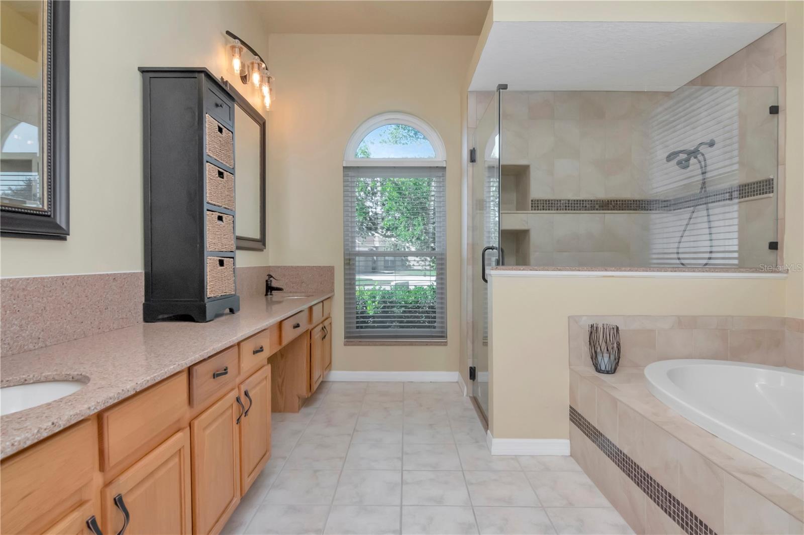 Updated Primary Ensuite with dual vanities, soaking tub, walk in shower