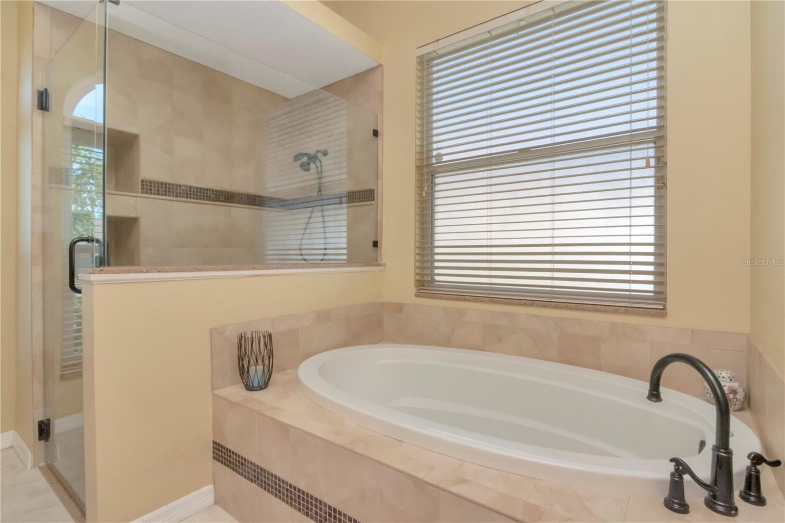 Updated Primary Ensuite with dual vanities, soaking tub, walk in shower