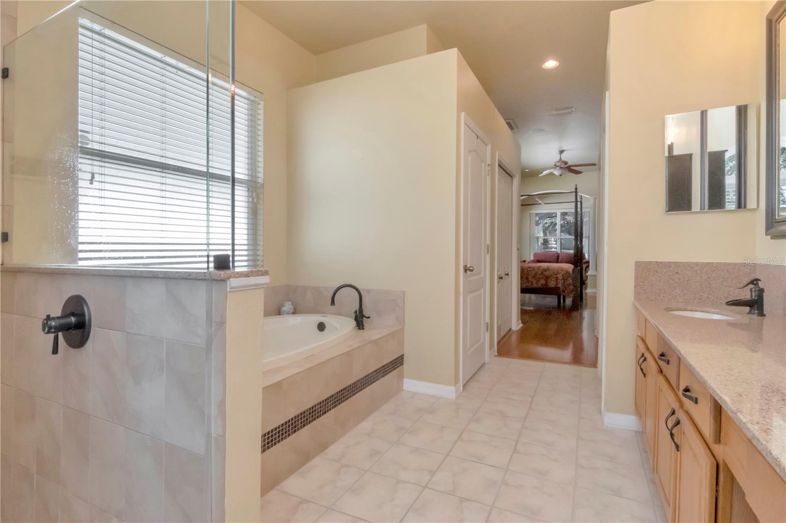 Updated Primary Ensuite with dual vanities, soaking tub, walk in shower