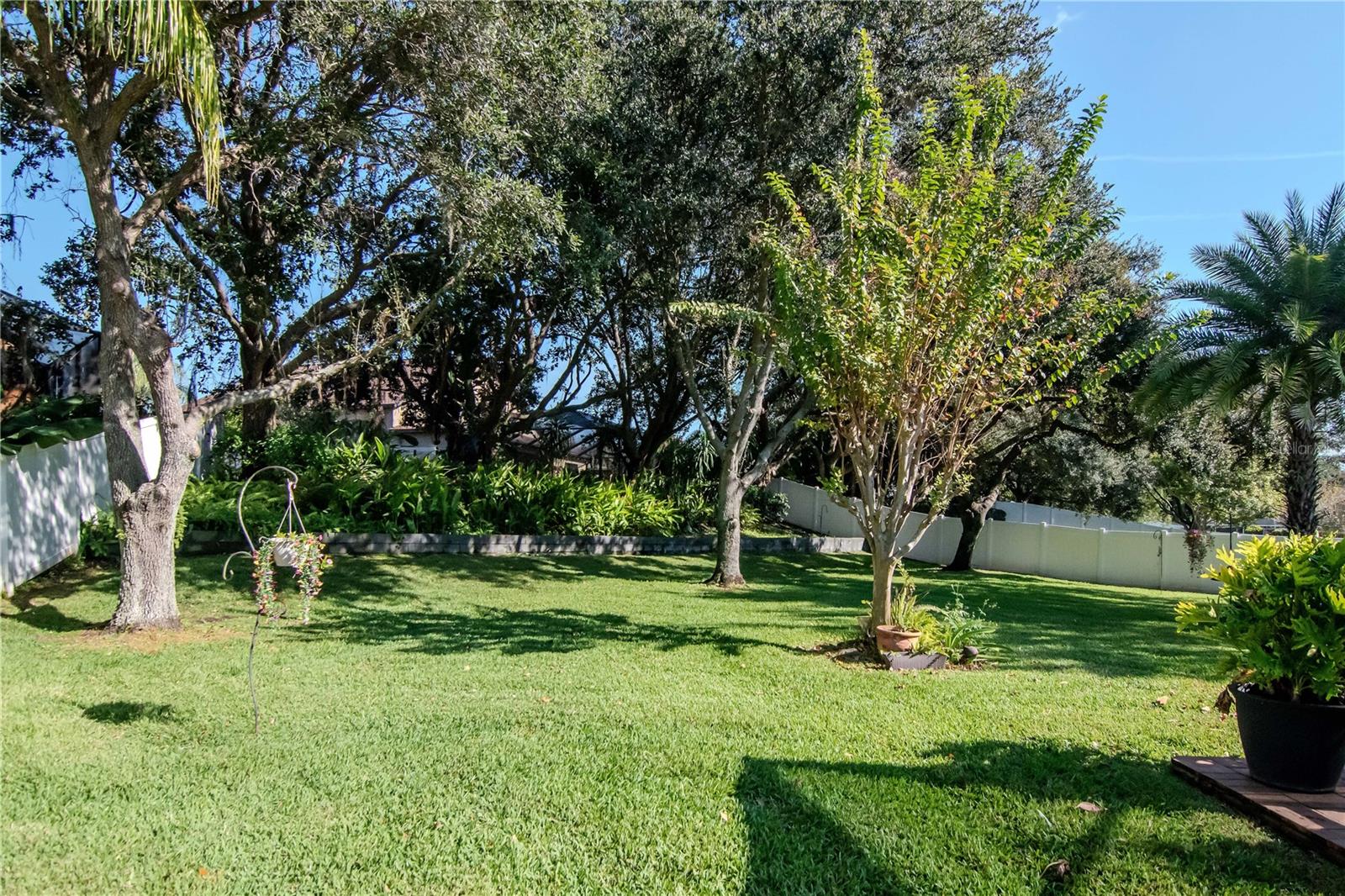 A true backyard oasis! 0.40 acres with lush landscaping and privacy