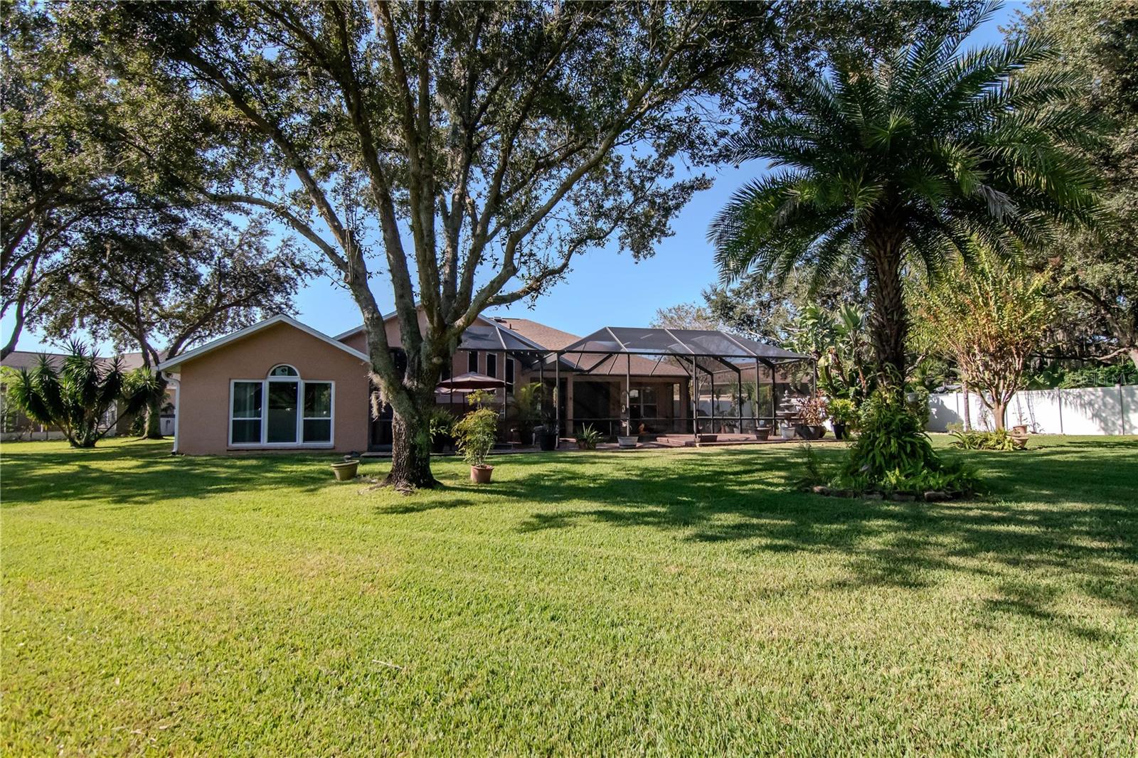 A true backyard oasis! 0.40 acres with lush landscaping and privacy