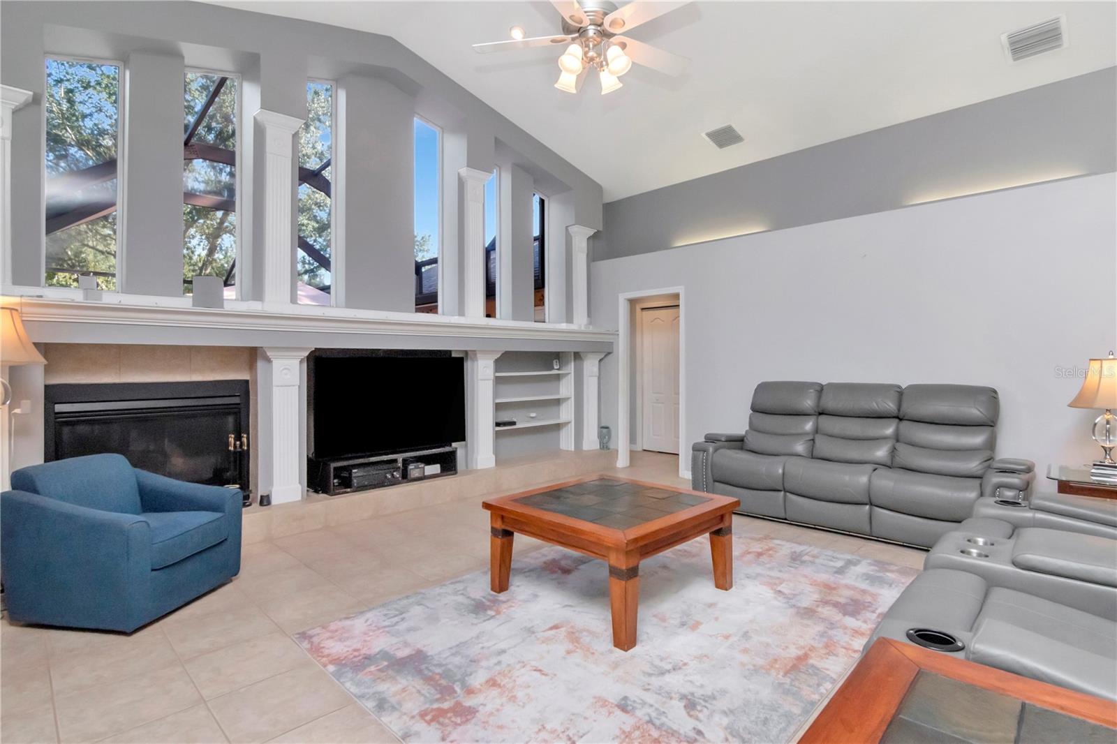Family room with LOTS if natural light, gas fireplace and custom built ins